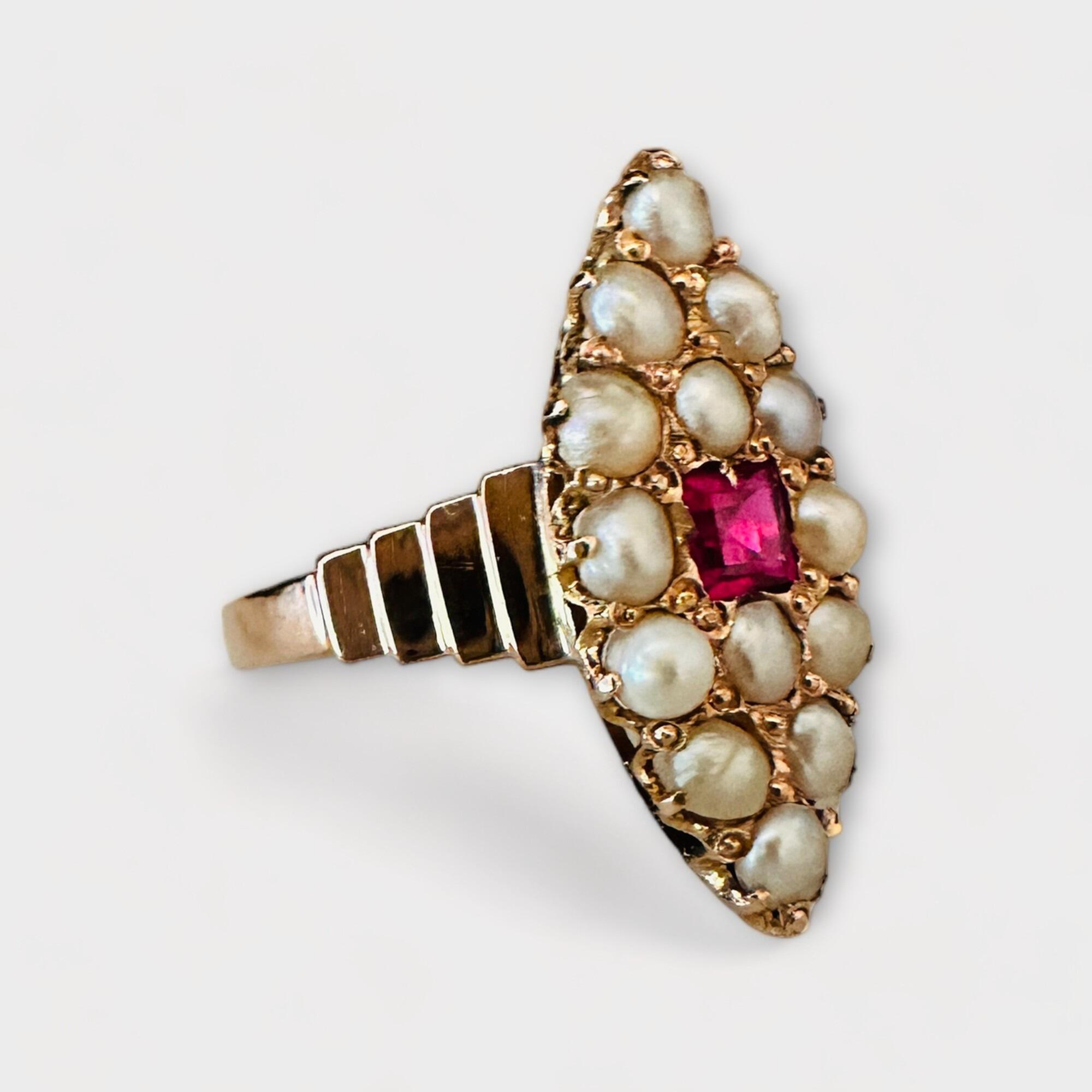 Exquisite Victorian antique pearl and ruby navette ring, circa 1880, featuring a central square-cut ruby and 14 pearls in gold setting.