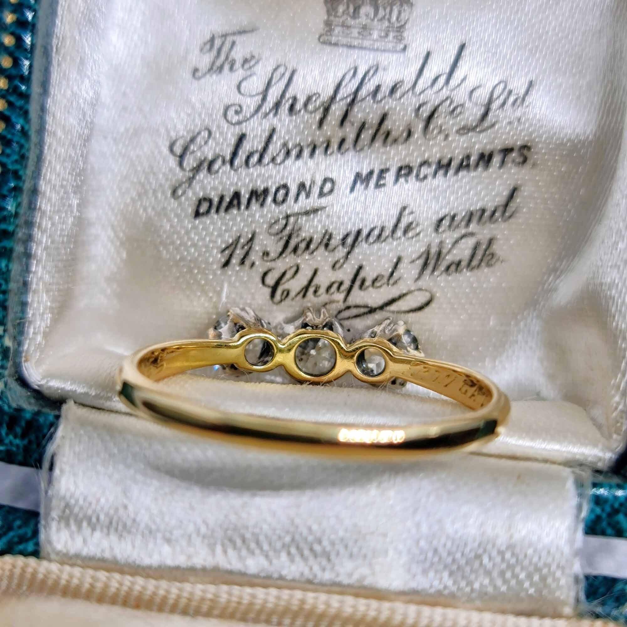 Vintage 1920s engagement ring with old European-cut diamonds in platinum and 18ct gold setting, engraved with initials and date.