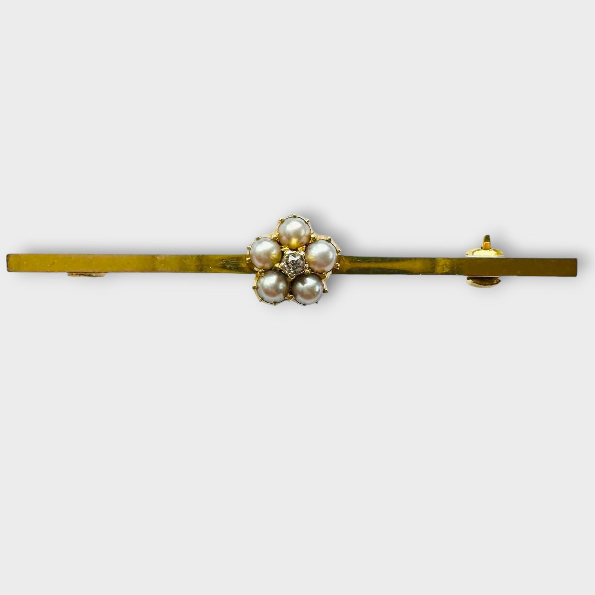 yellow gold bar brooch with central pearl and diamond daisy