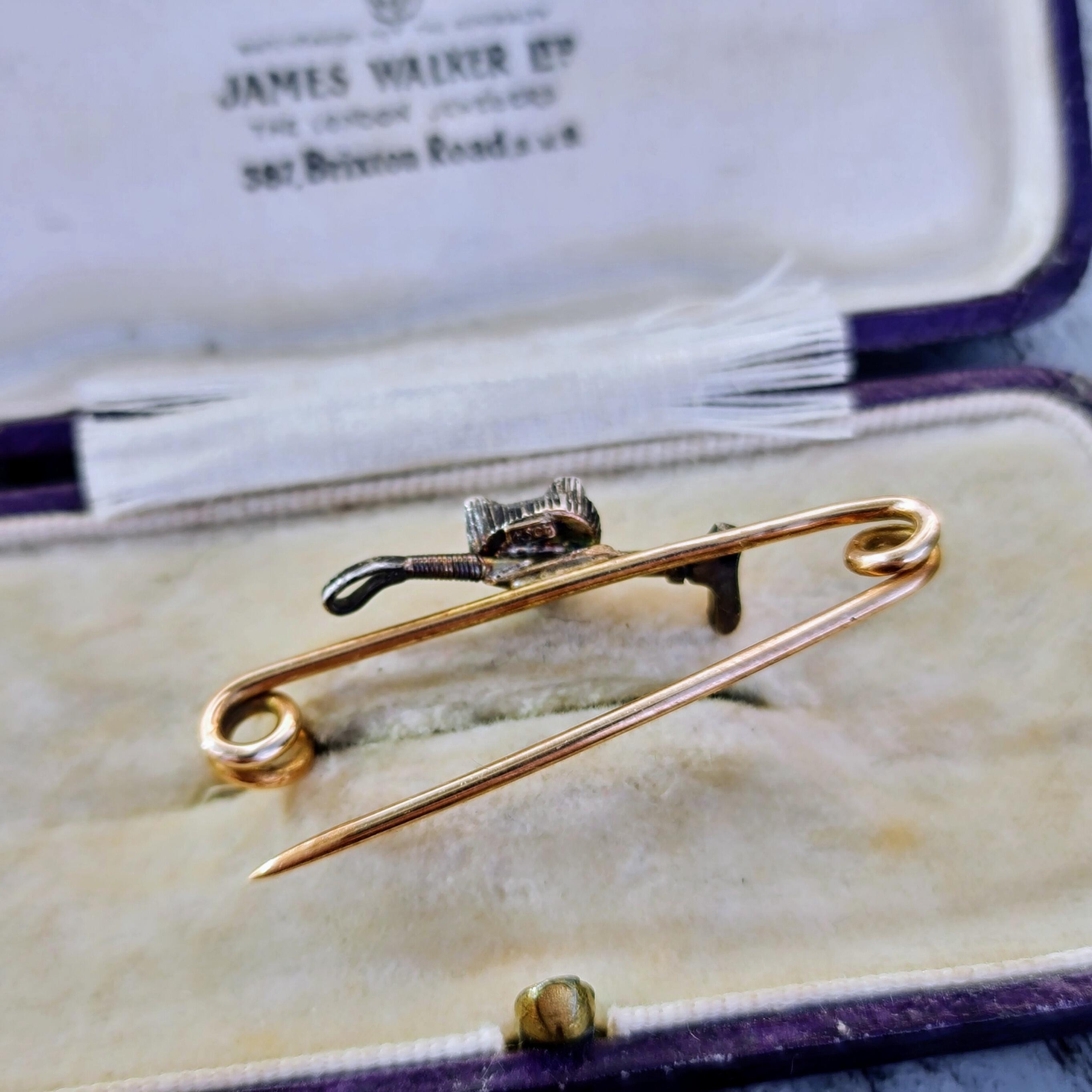 Antique fox head brooch with rose-cut diamonds and ruby eyes on yellow gold pin