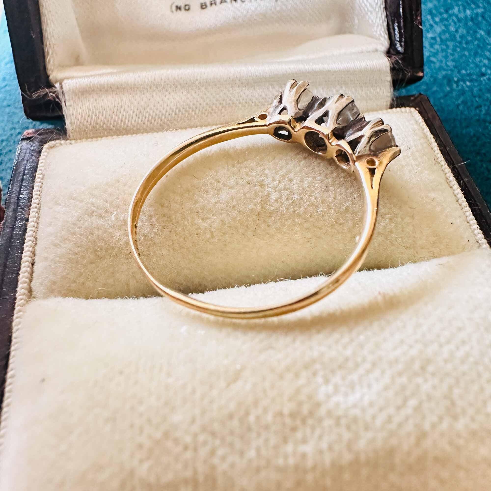 Circa 1930s Art Deco ring with three old European-cut diamonds in 18ct yellow gold, symbolizing 'I-Love-You' or 'Past, Present & Future'.