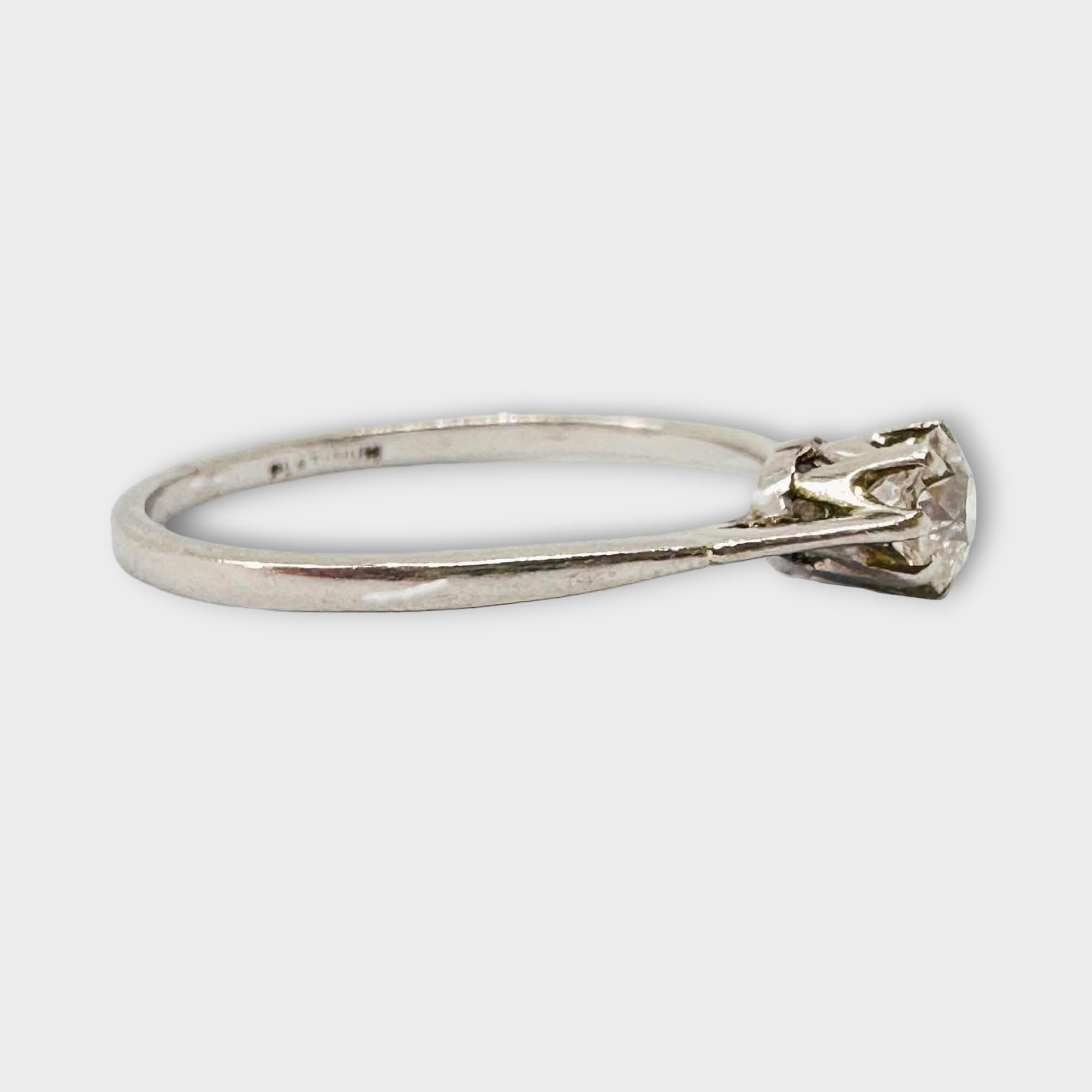 Vintage Art Deco engagement ring with 4mm old-cut diamond, sleek design, and elegant profile.