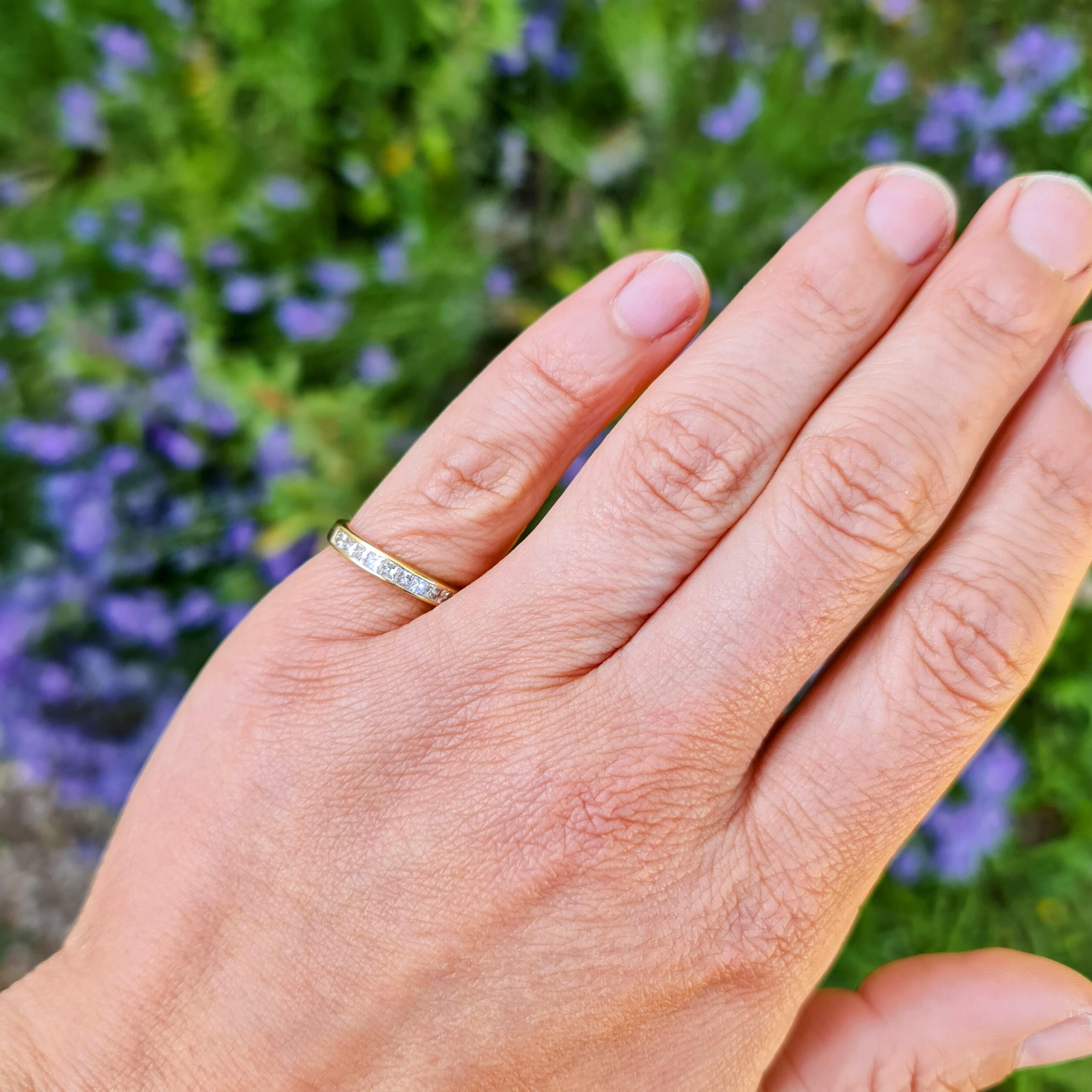 Princess-cut diamond eternity ring in 18ct yellow gold