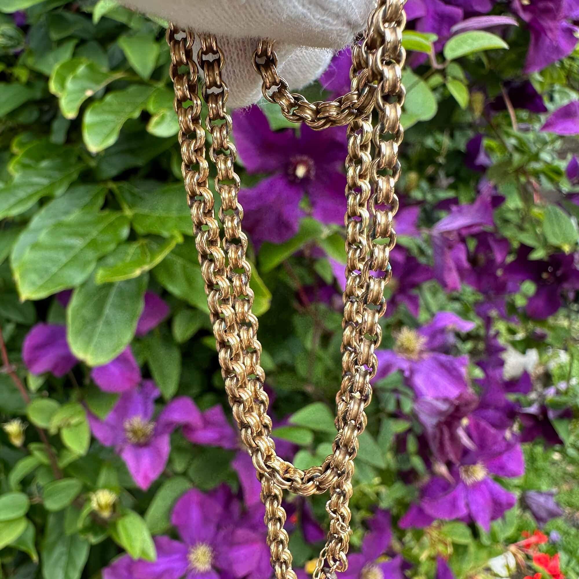 Exquisite Victorian 9ct gold double belcher link chain with barrel clasp and safety chain in garden with purple flowers