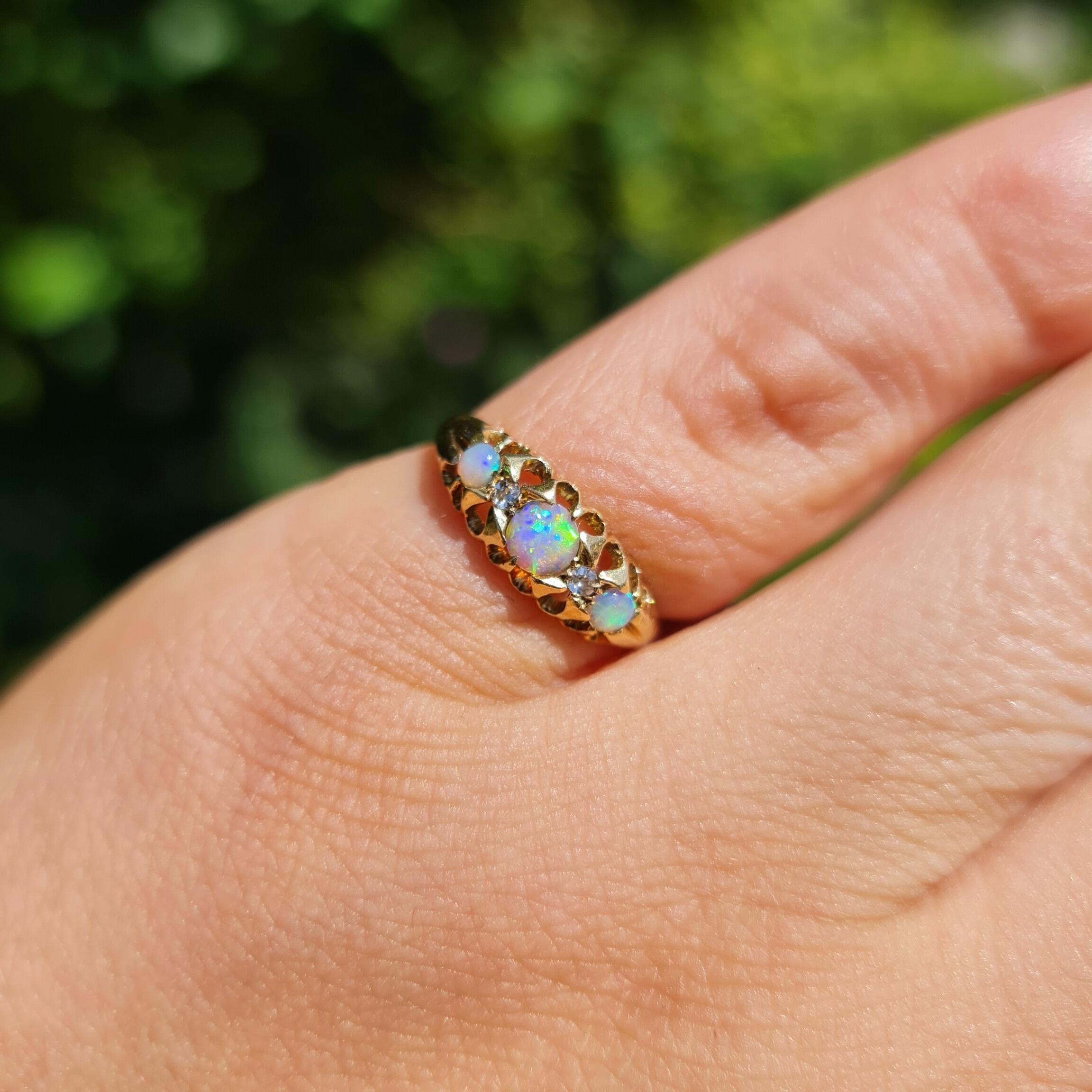 Victorian boat ring with three round opals and two diamonds in 18ct yellow gold