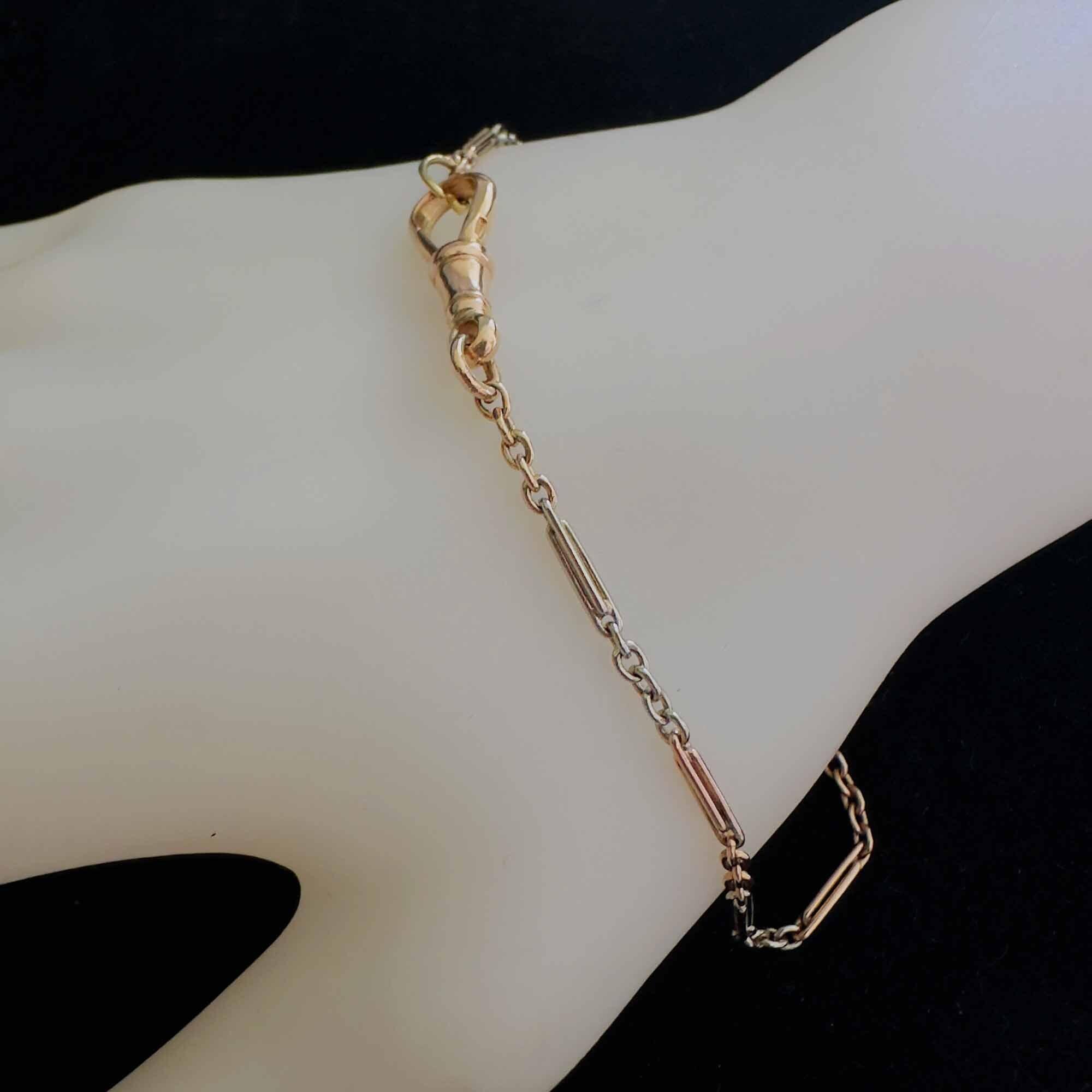 Edwardian white and yellow 9ct gold alternating trombone link bracelet