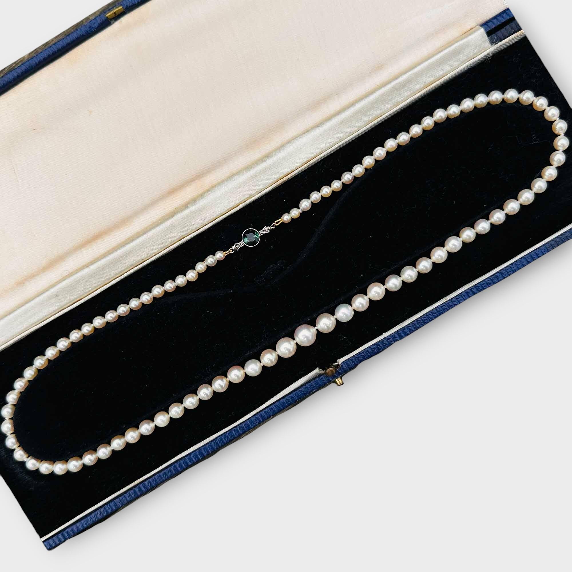 Art Deco necklace with row of graduated cultured saltwater pearls on green tourmaline and diamond clasp