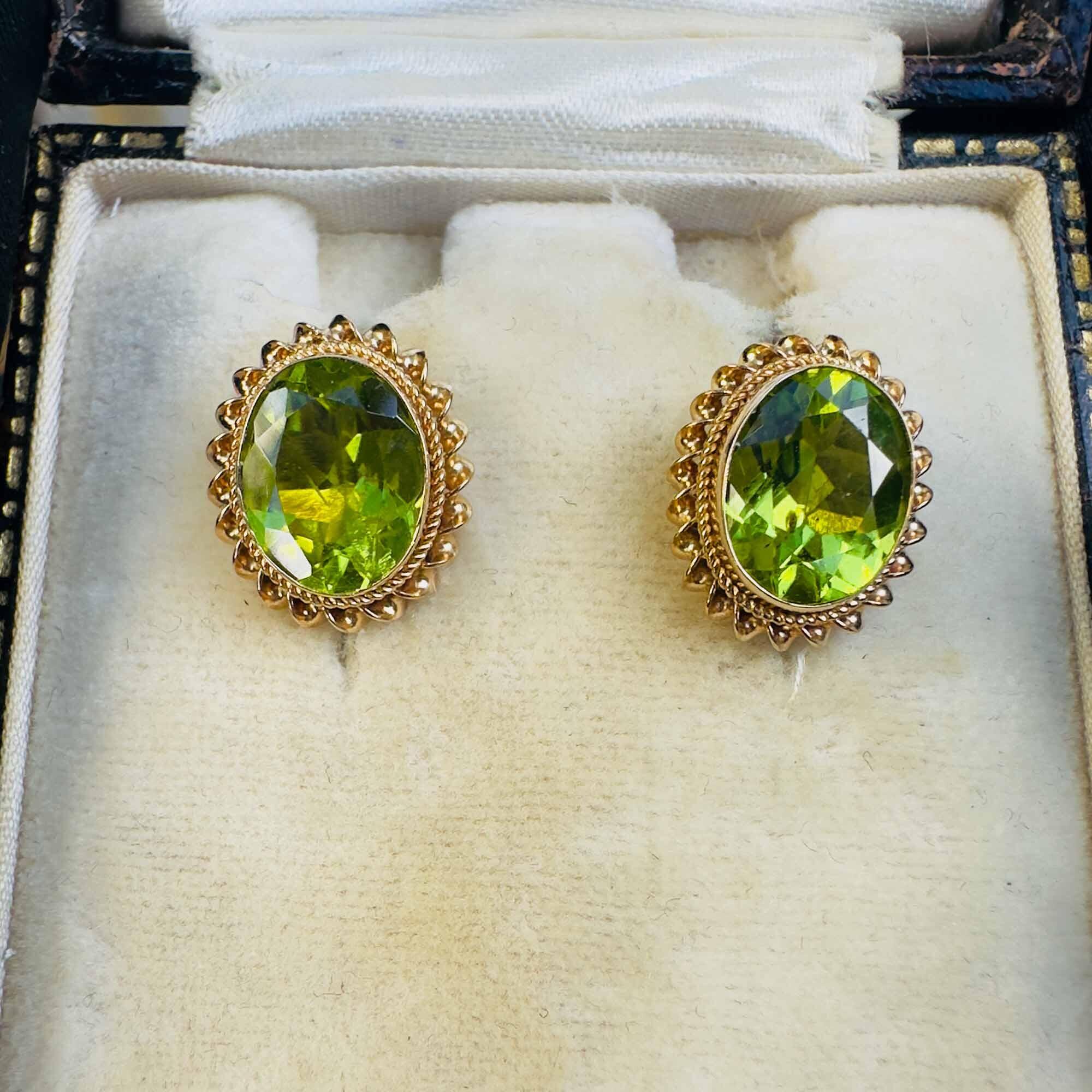 pair of vintage peridot earrings in 9ct gold collet settings with rope frame
