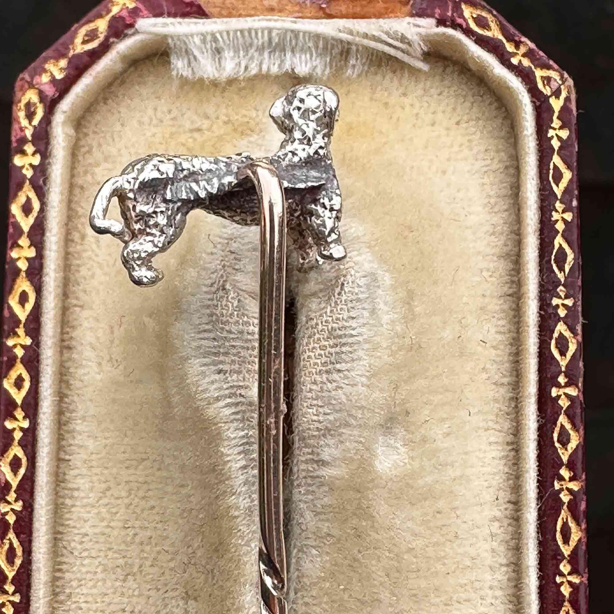 Early Victorian rose-cut diamond studded dog stick pin with ruby eye in silver mounted on a yellow gold pin, in antique box