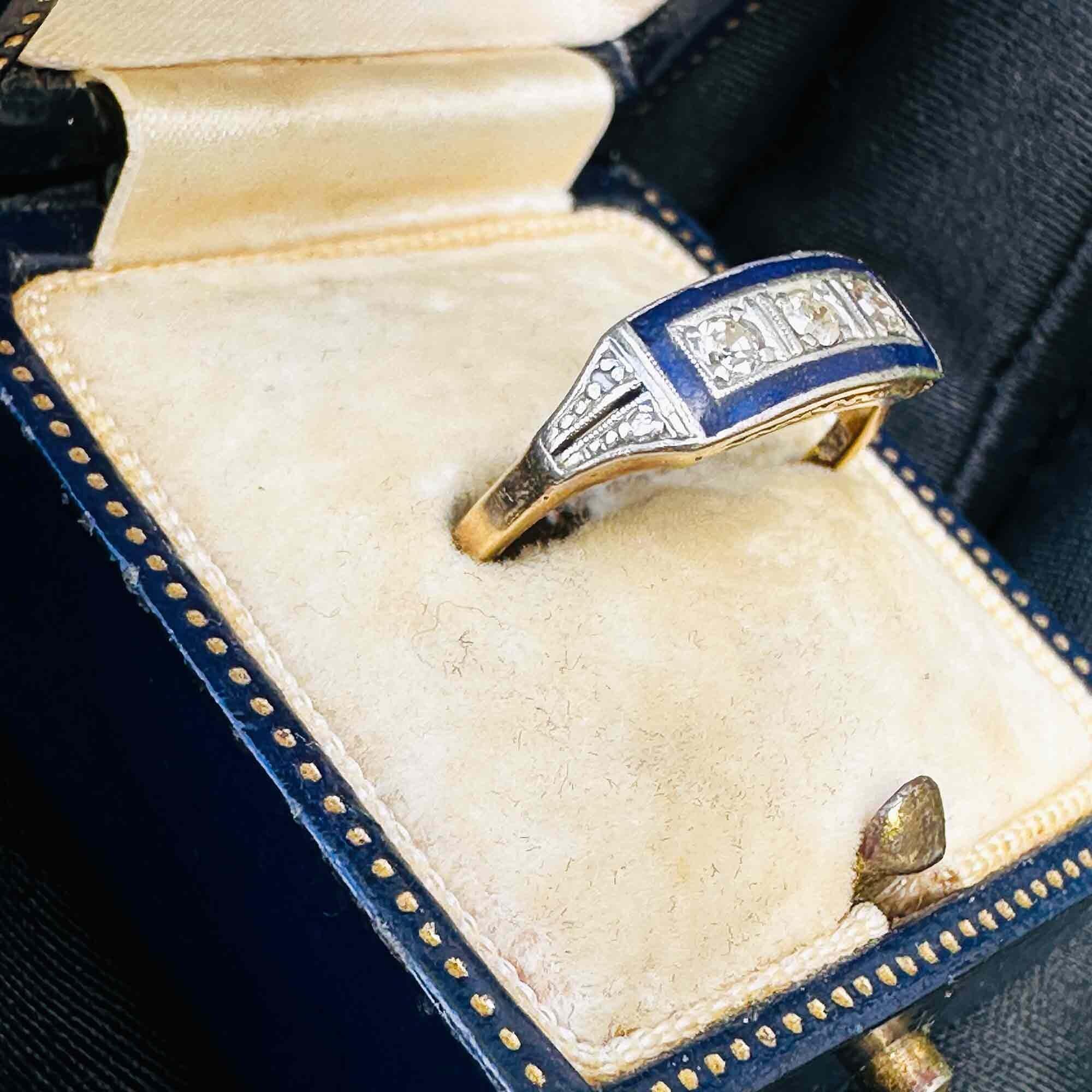Art Deco rectangular ring with three old cut diamonds framed by a blue enamel border, crafted in 18ct gold