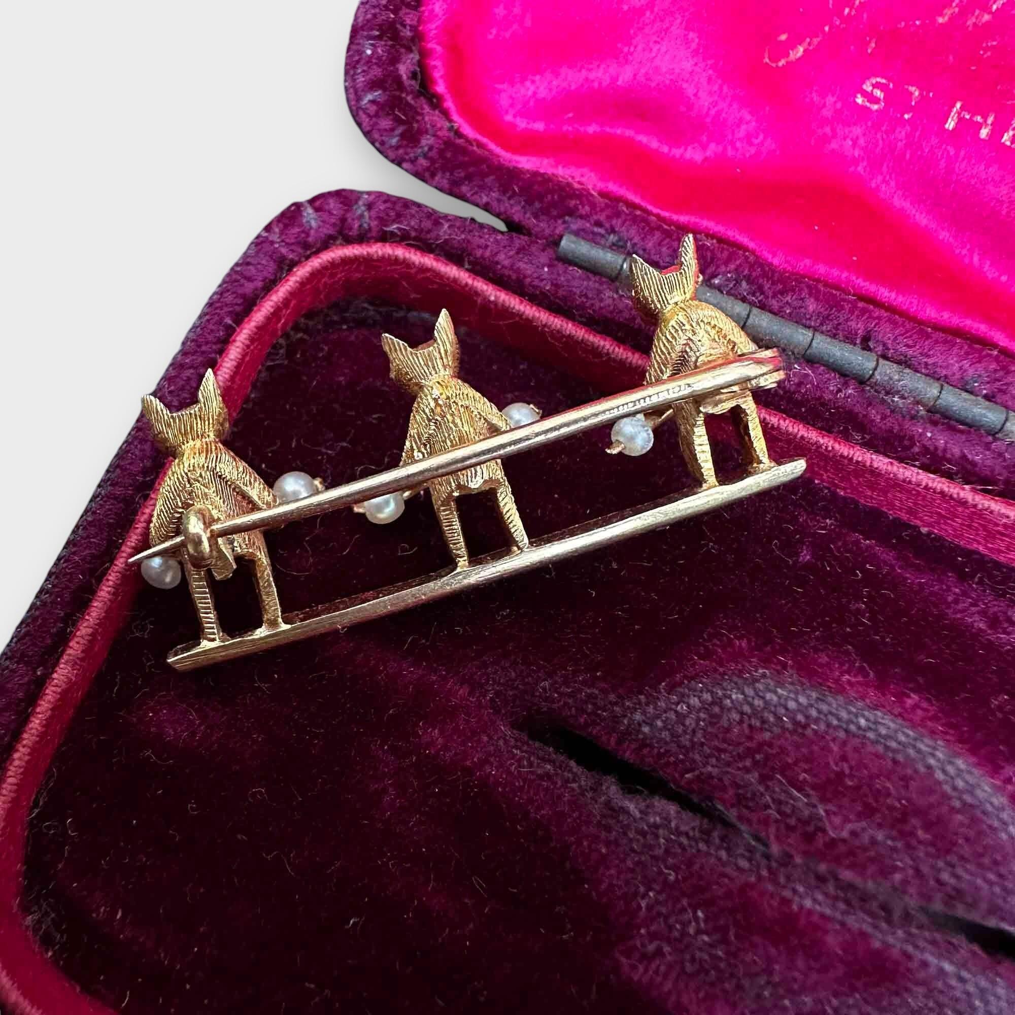 Edwardian 15ct yellow gold bar brooch with three bears each holding a pearl studded stick