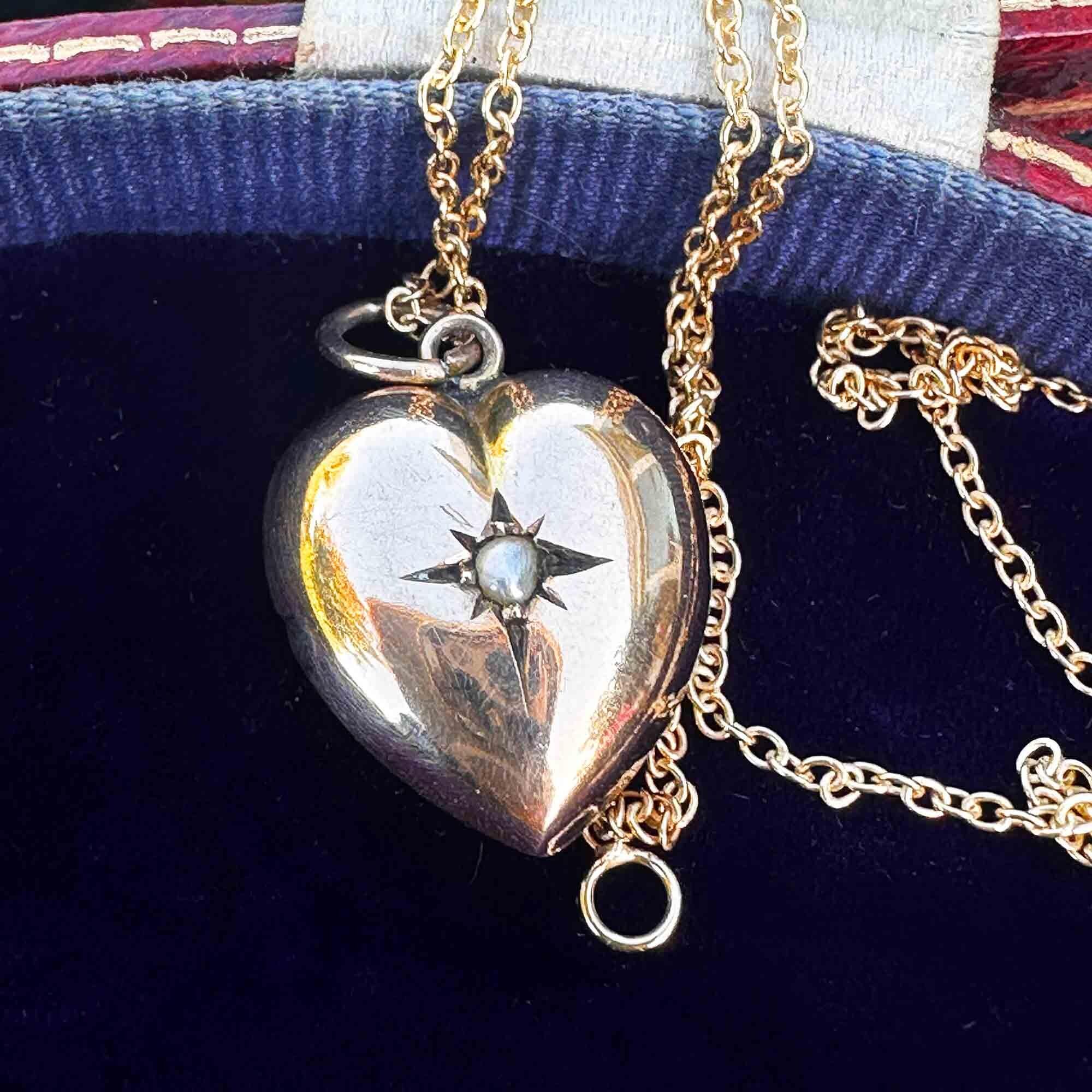Victorian 9ct yellow gold puffy heart pendant with a central star set pearl