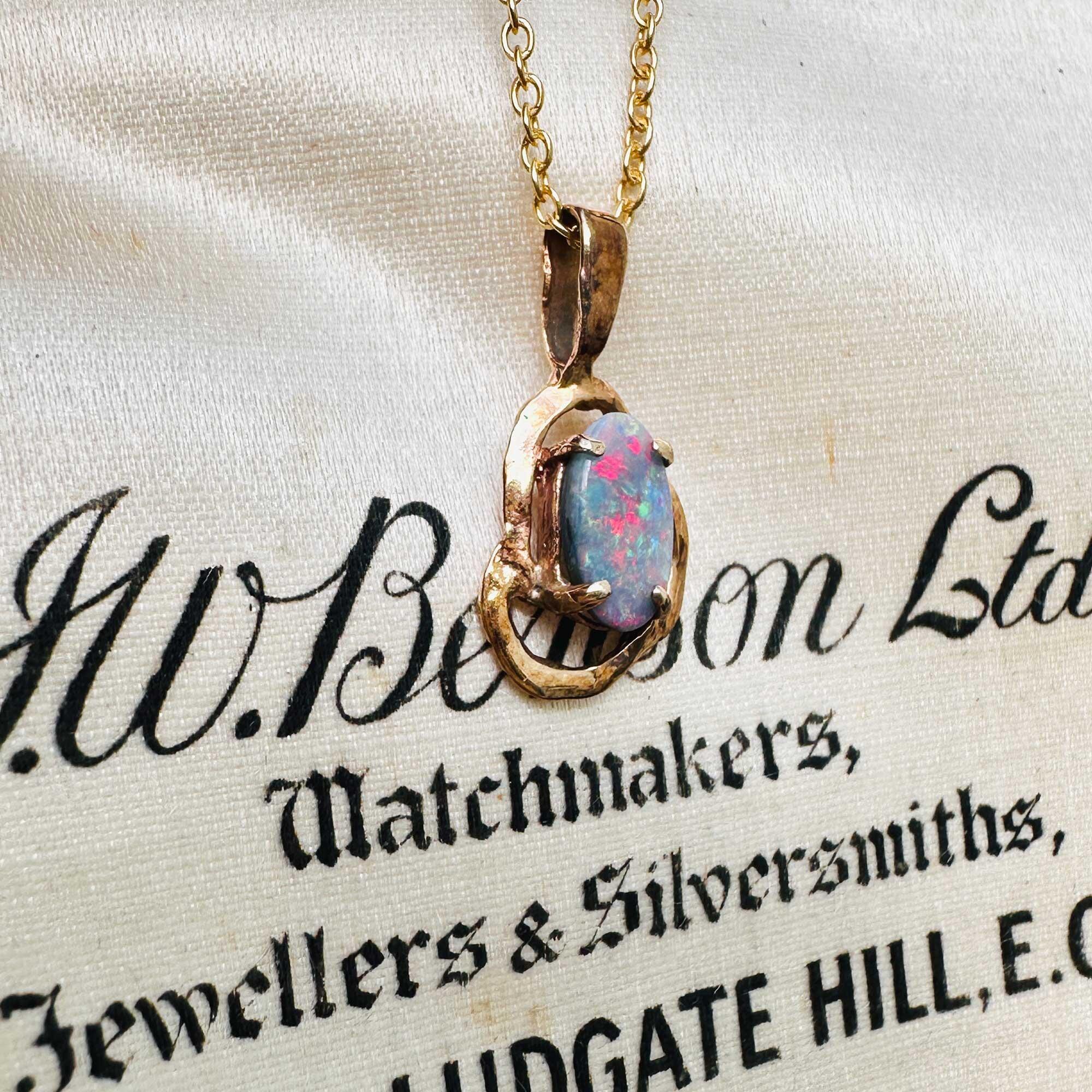 dainty contemporary blue opal pendant in rose gold 9ct openwork abstract frame