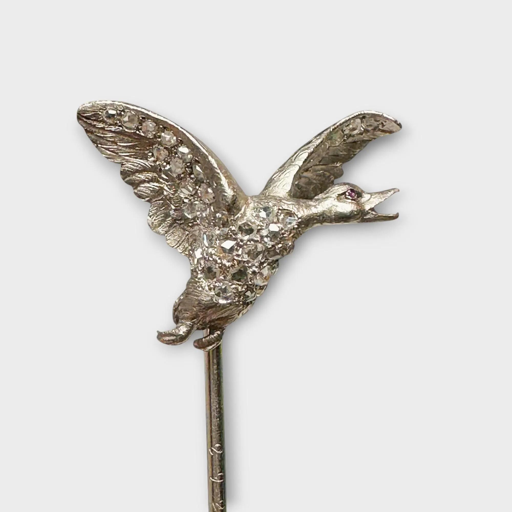 Antique Edwardian platinum stick pin featuring a duck adorned with rose-cut diamonds and a cabochon ruby eye