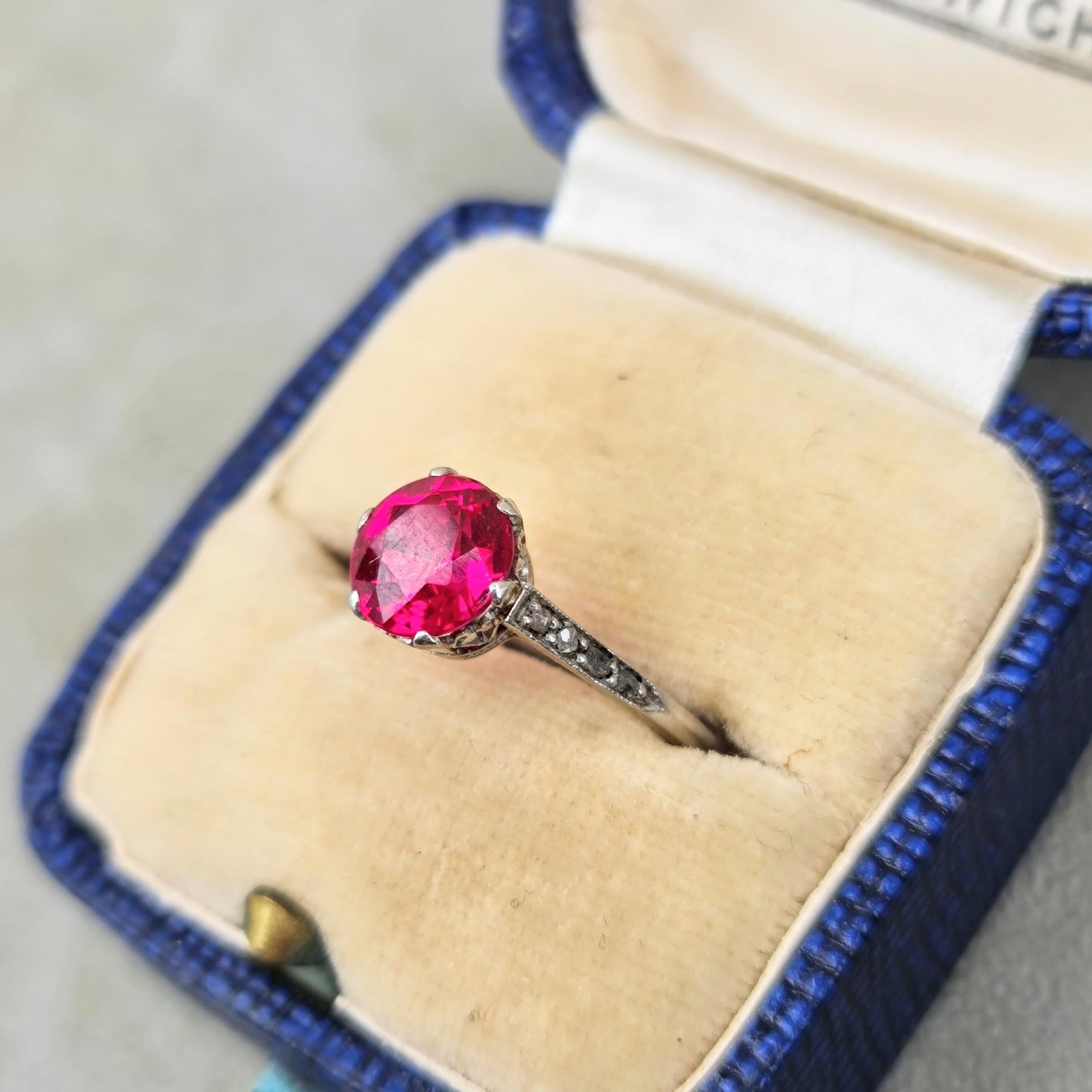 Antique Art Deco platinum and synthetic pink ruby solitaire ring with rose cut diamond shoulders
