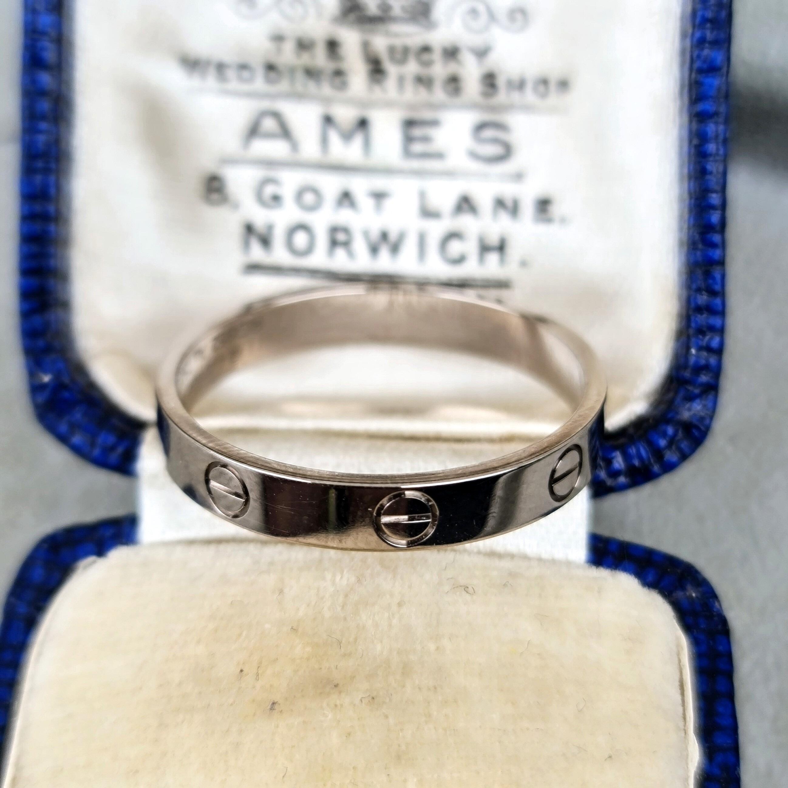 Modern 18ct white gold genuine Cartier band with screw motifs