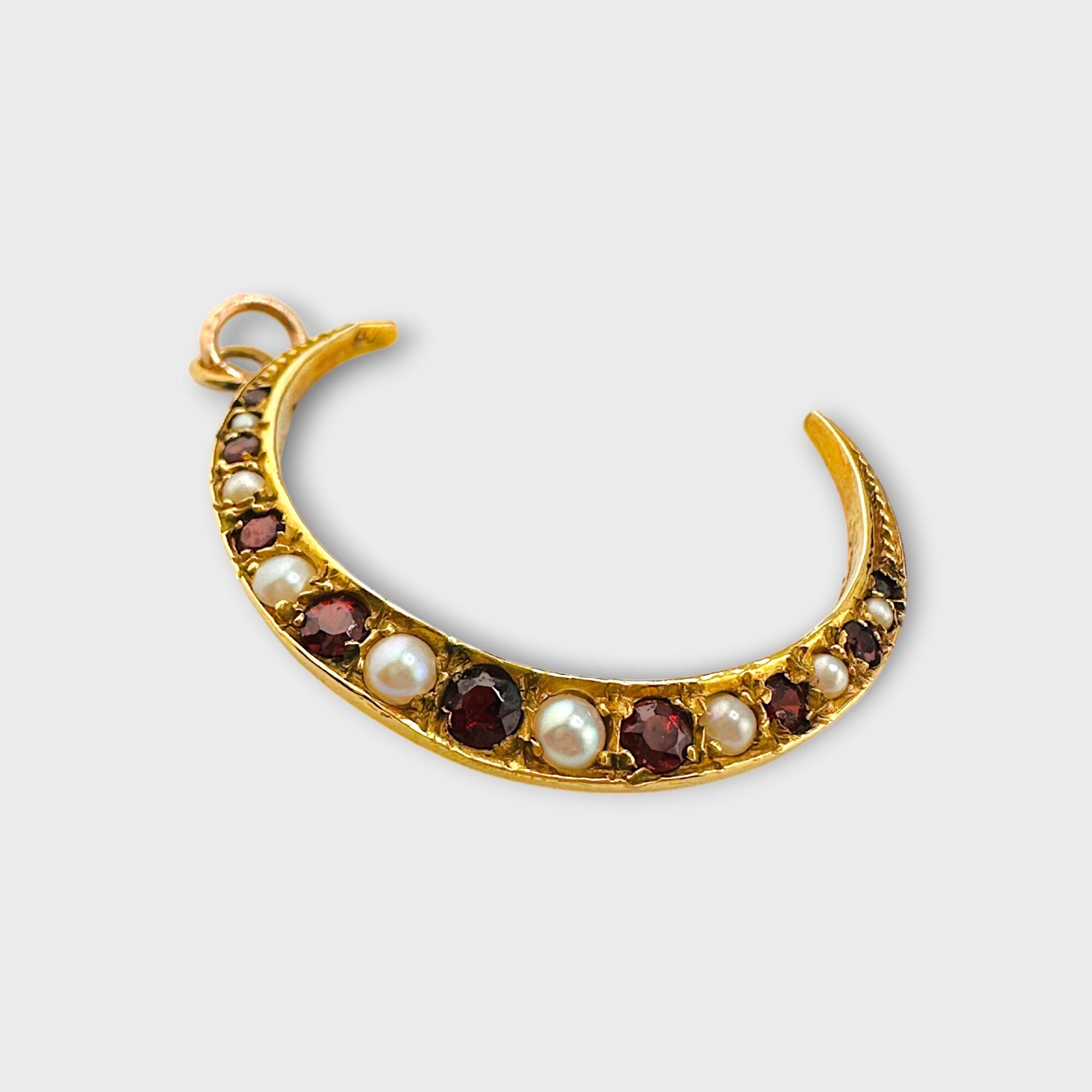 Edwardian 9ct Gold Garnet & Pearl Crescent Moon Pendant on grey background