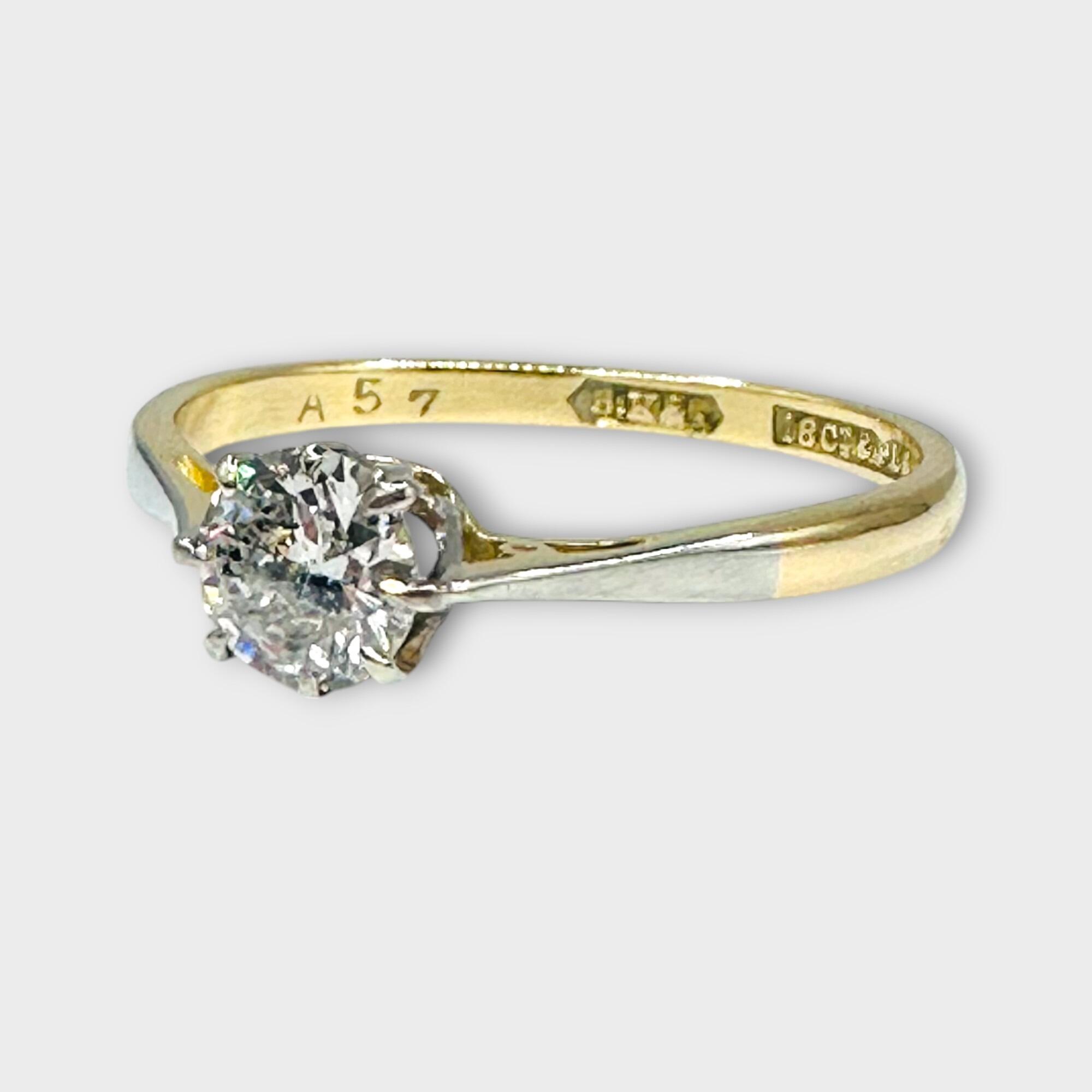 Art Deco 18ct gold and platinum solitaire ring with 0.50ct European cut diamond on grey background