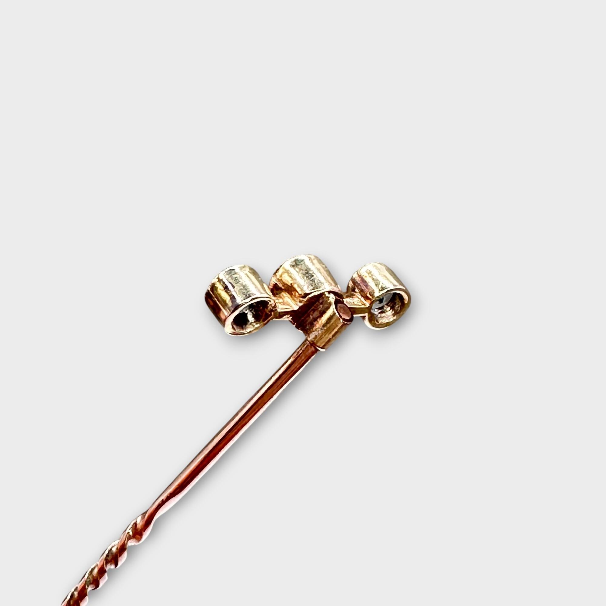 Art deco aquamarine and pearl trilogy stick pin on grey background, reverse view.