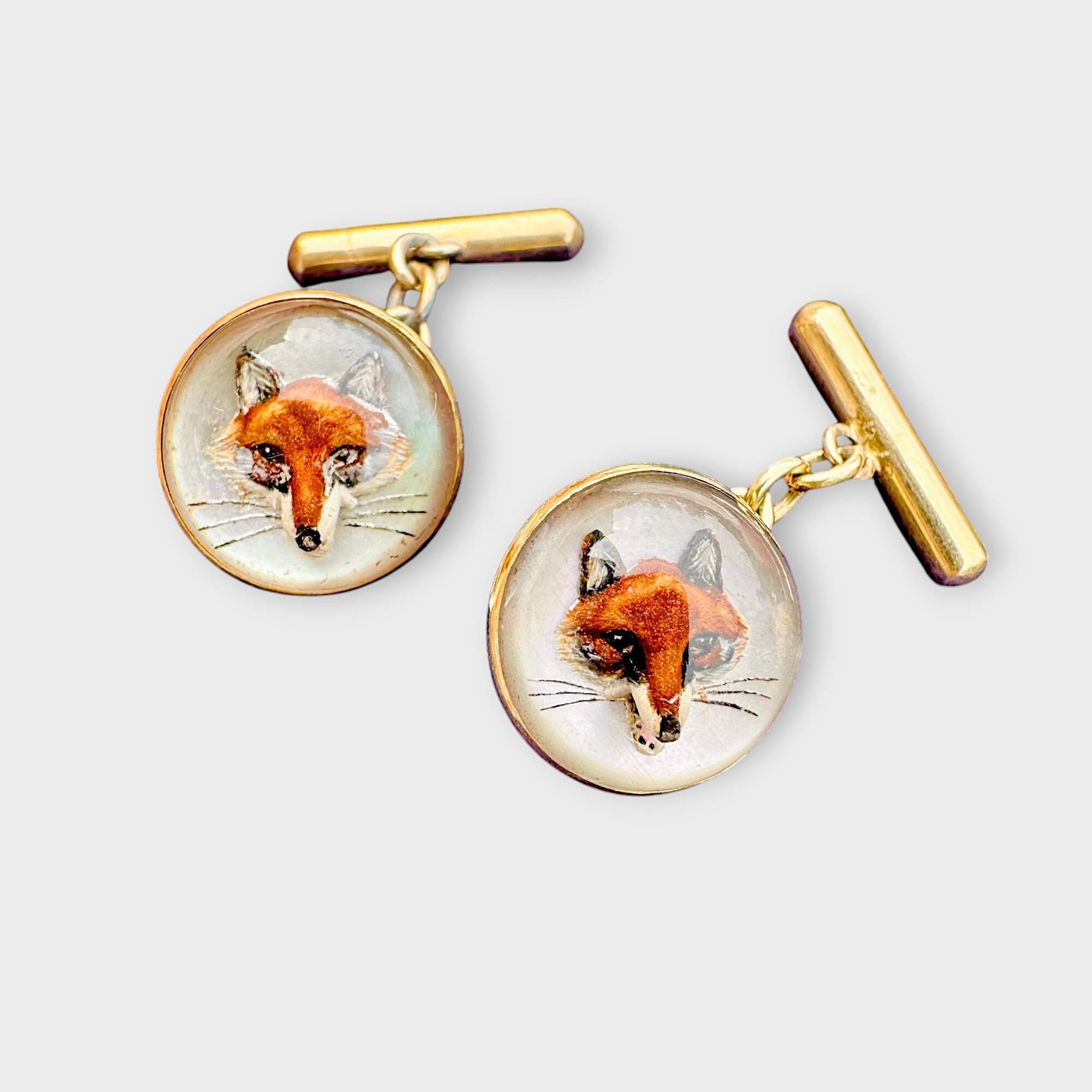 Edwardian 18k Gold Intaglio, Essex crystal fox head cufflinks on grey background.