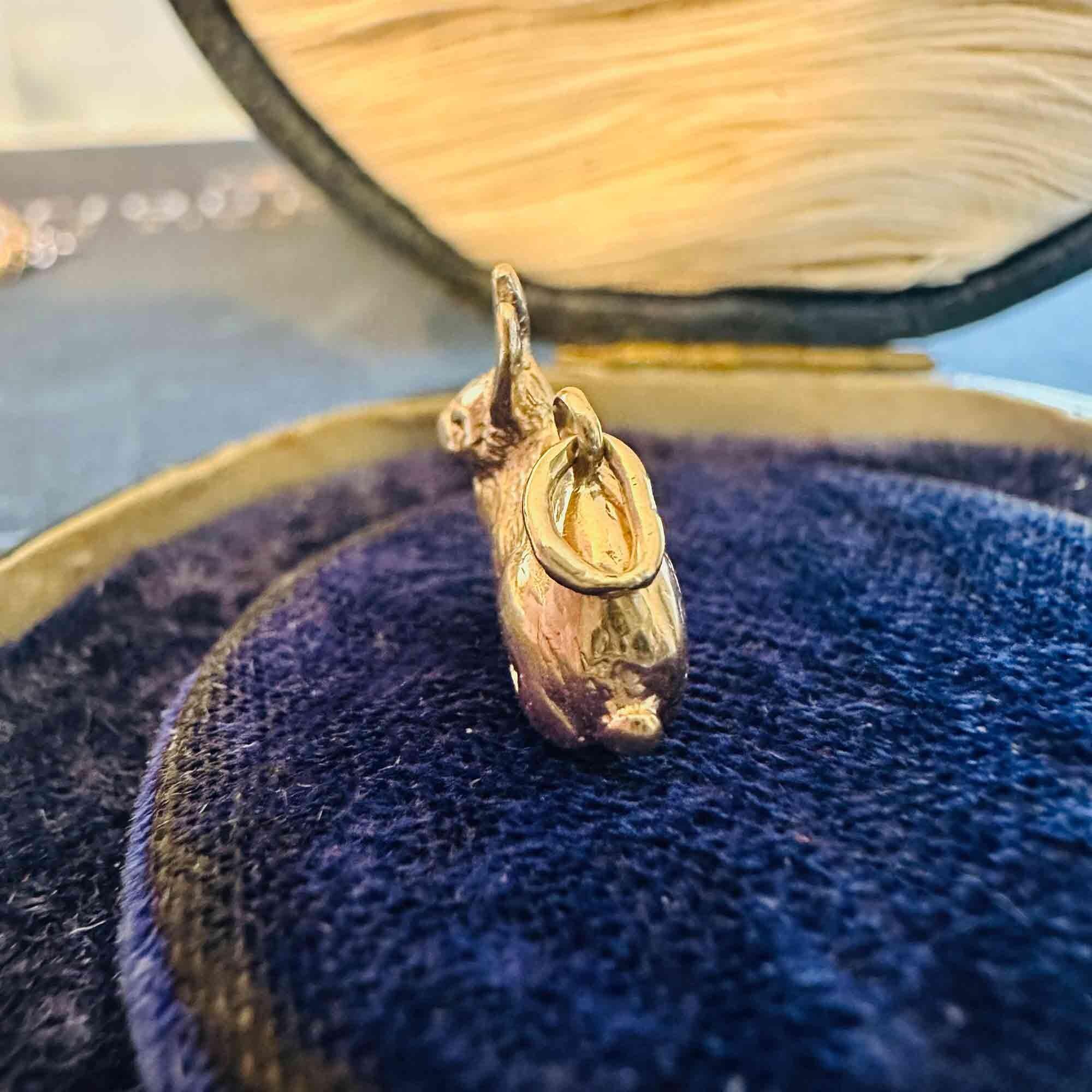 9ct gold rabbit charm on antique box.