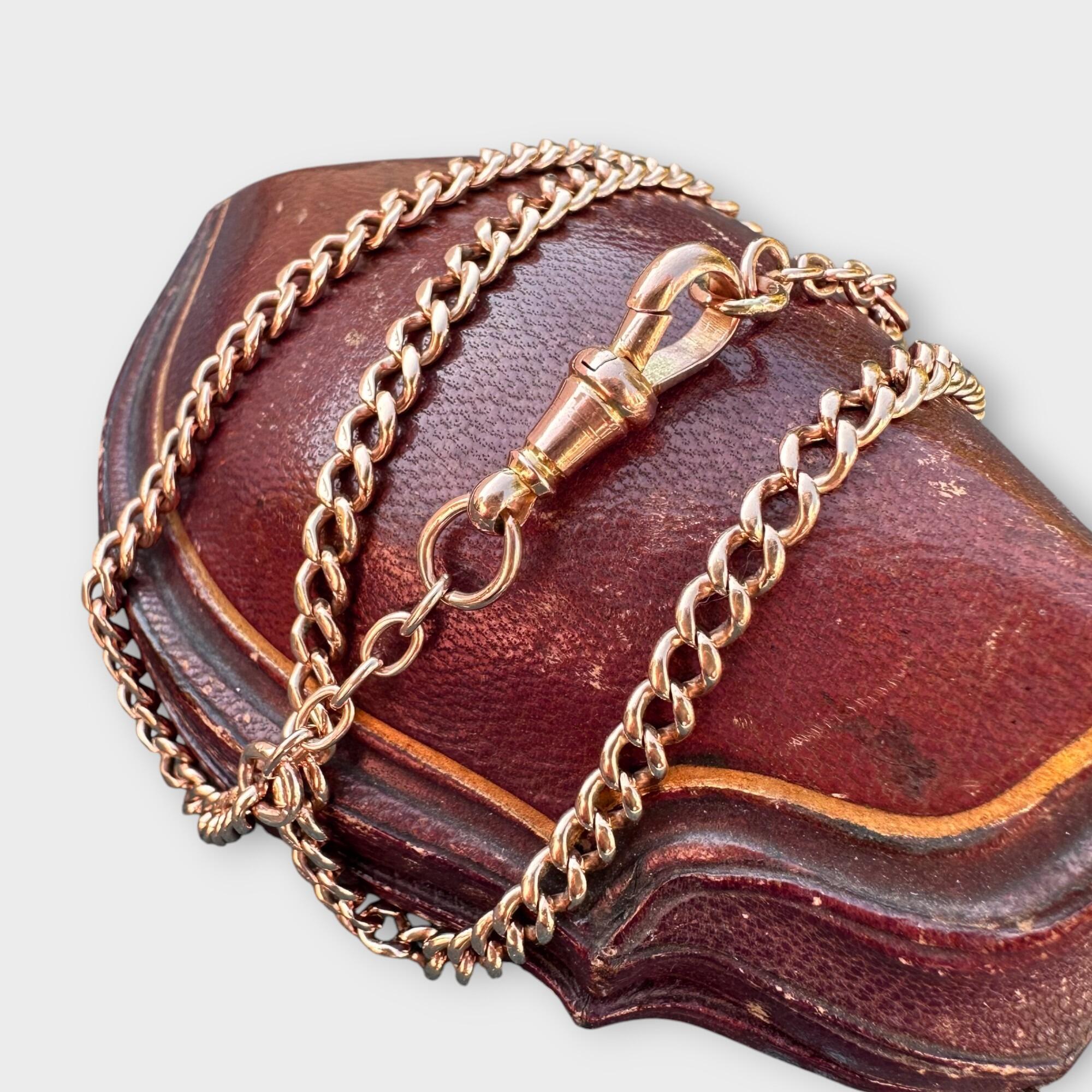 Edwardian 9ct Rose Gold Albert chain with dog clip, 19" / 48cm, on a red antique box.