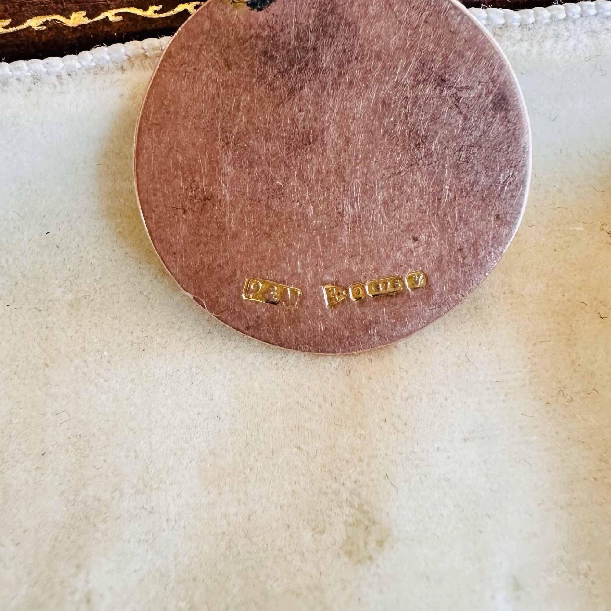 Antique 9ct rose gold medallion with Chester 1924 hallmark by maker P&M on antique box, close up of hallmarks.