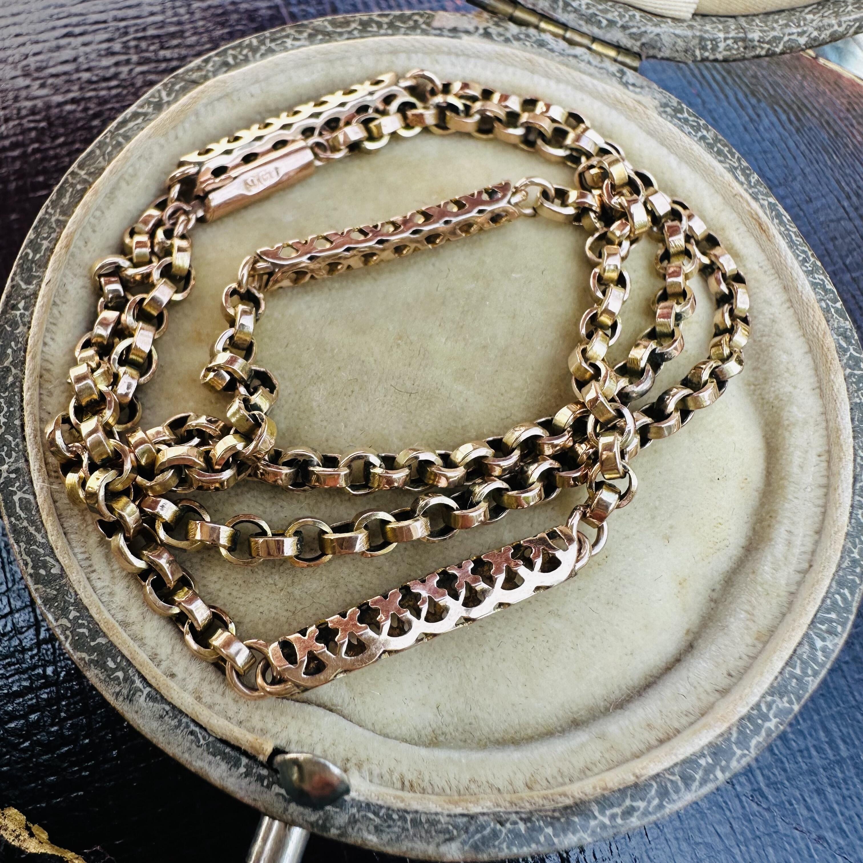 Victorian 9k gold handmade belcher chain with ornate tubular links and secure barrel clasp coiled in antique box.