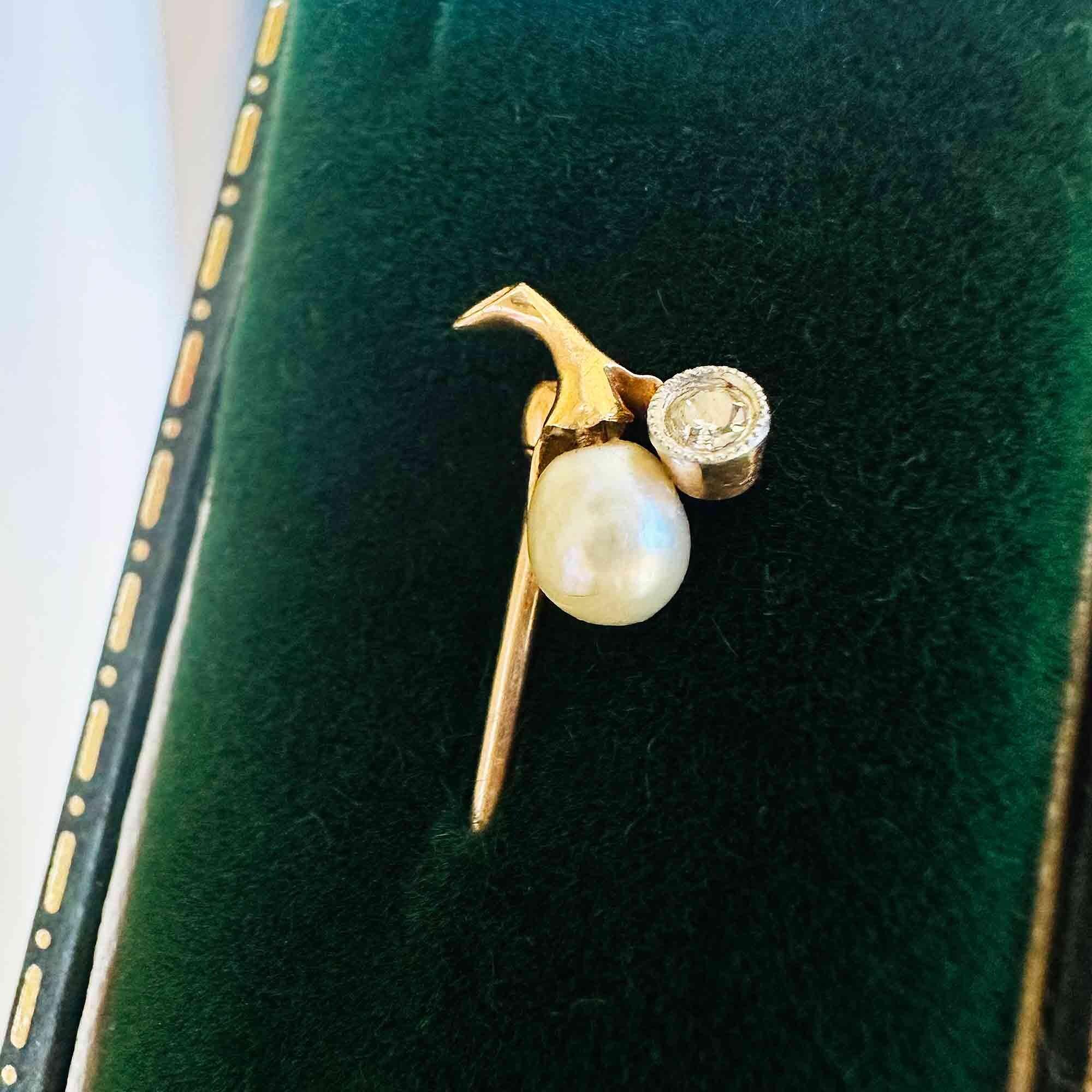 Art Nouveau stick pin in 15k gold with pear-shaped pearl and diamond berry design on green velvet box.