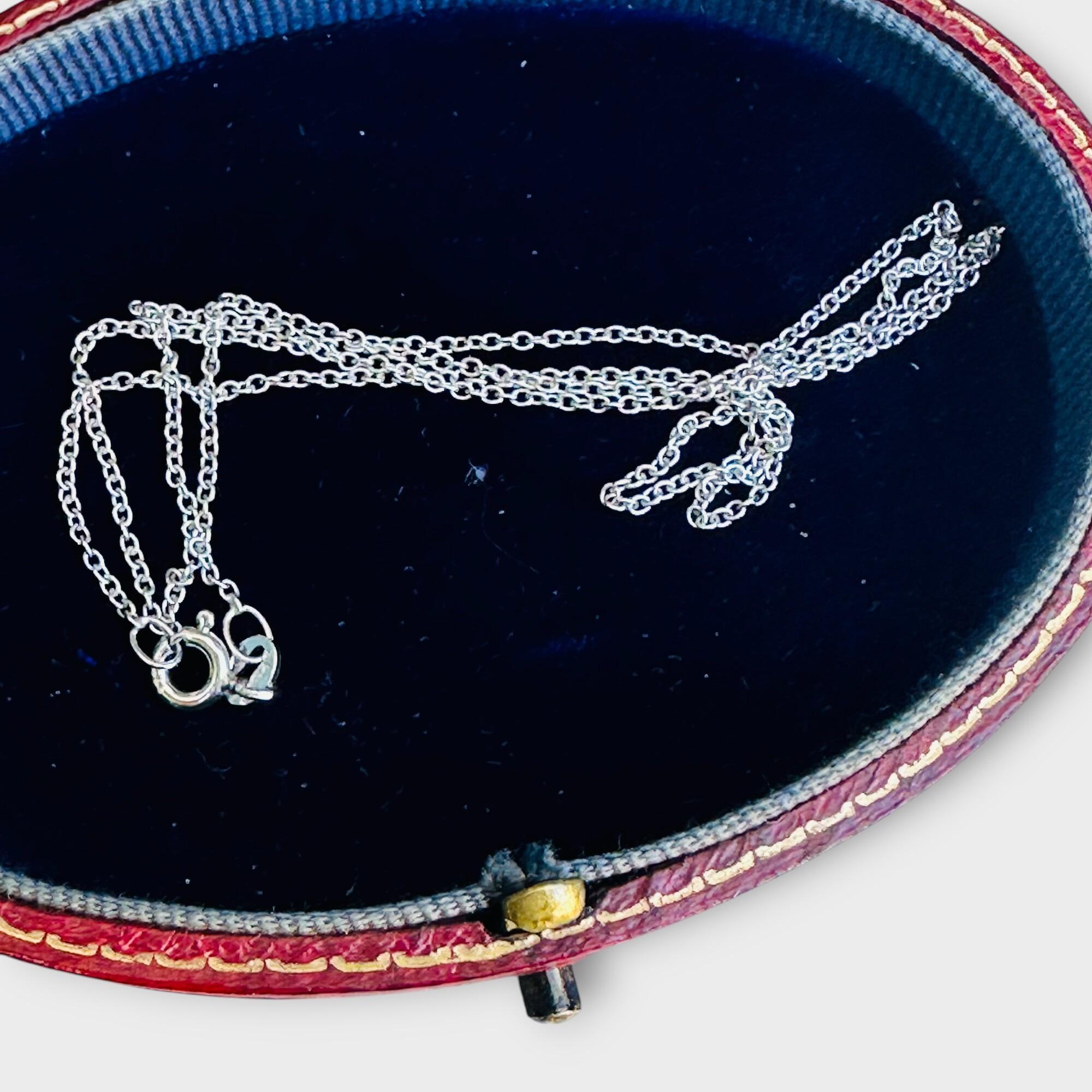 Delicate 9ct white gold necklace with rolo links, UK hallmarked, displayed in antique box.