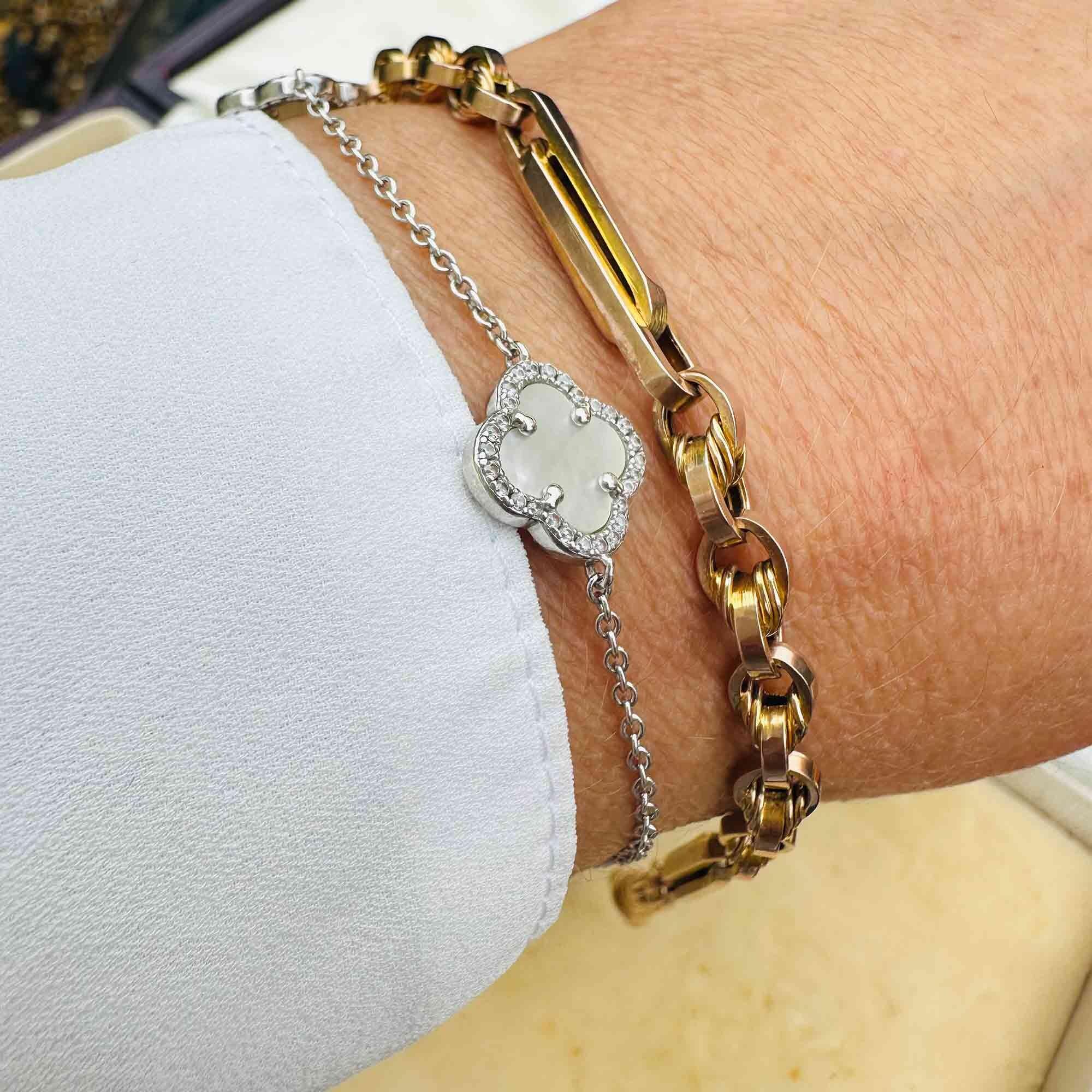 8 inch rose gold bracelet with trombone links on models wrist.