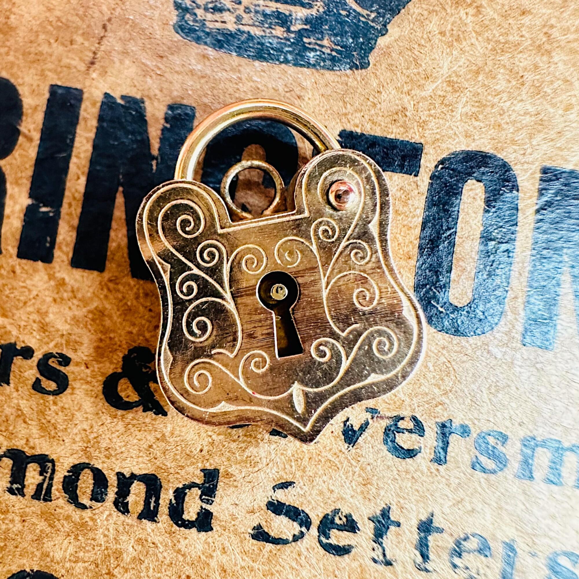 Rare, Romantic Antique 9k Rose Gold Shield Padlock Clasp displayed on antique box.