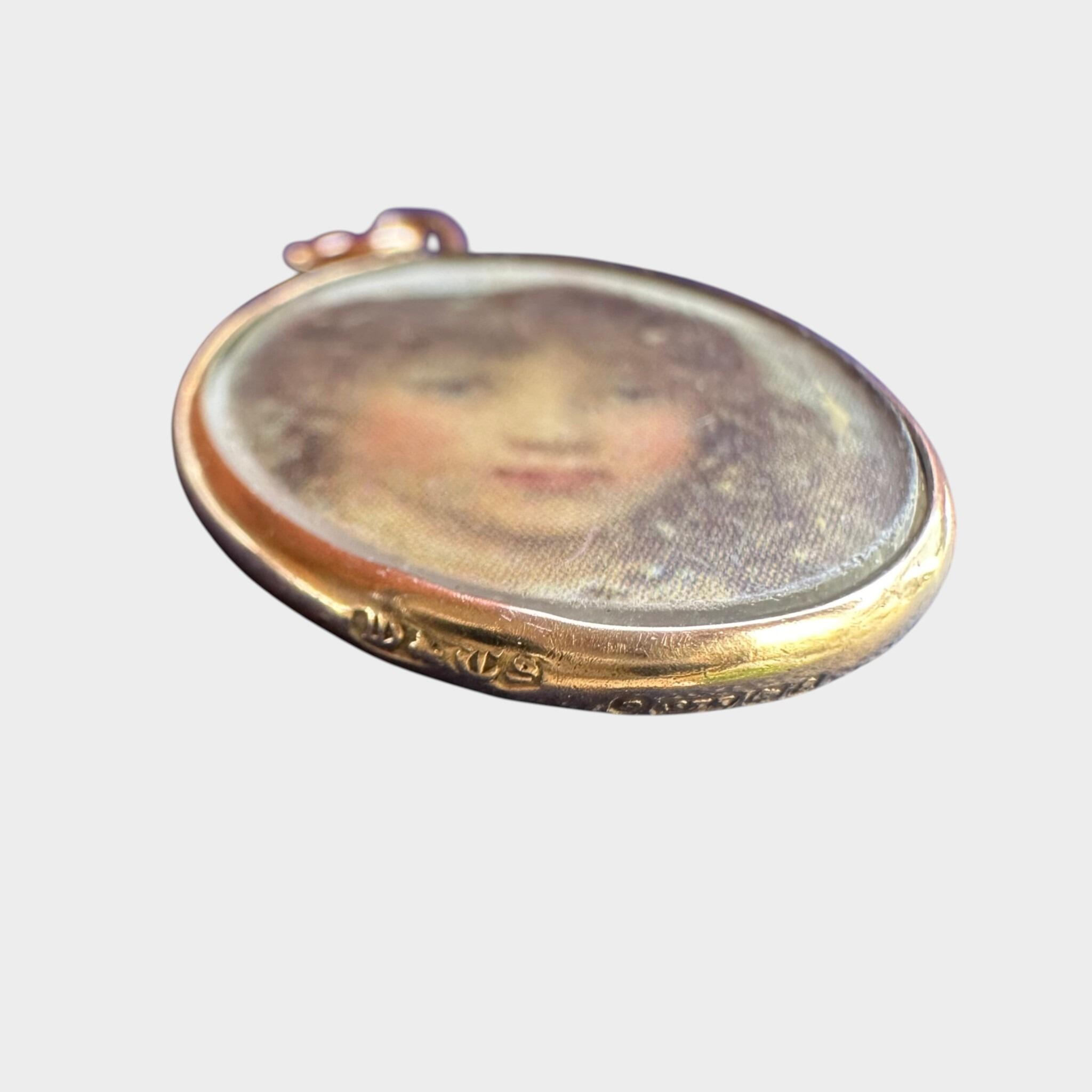 side profile of Art Nouveau Rose Gold Locket with Portrait with grey background