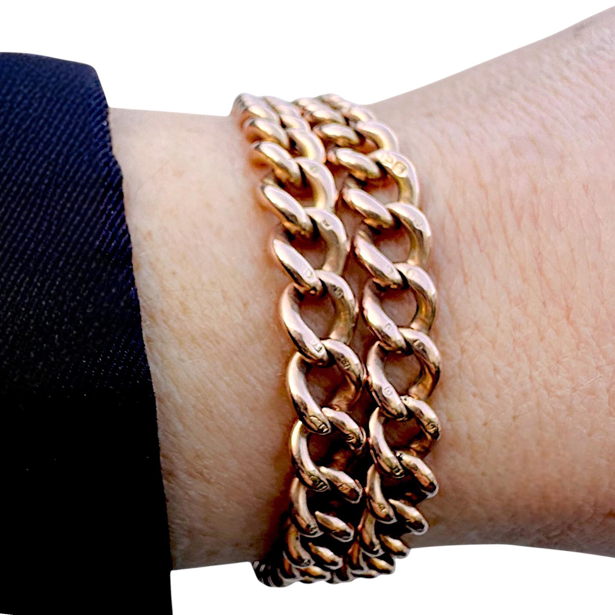 Rose Gold Double Curb Link Bracelet with Heart Padlock worn on models wrist