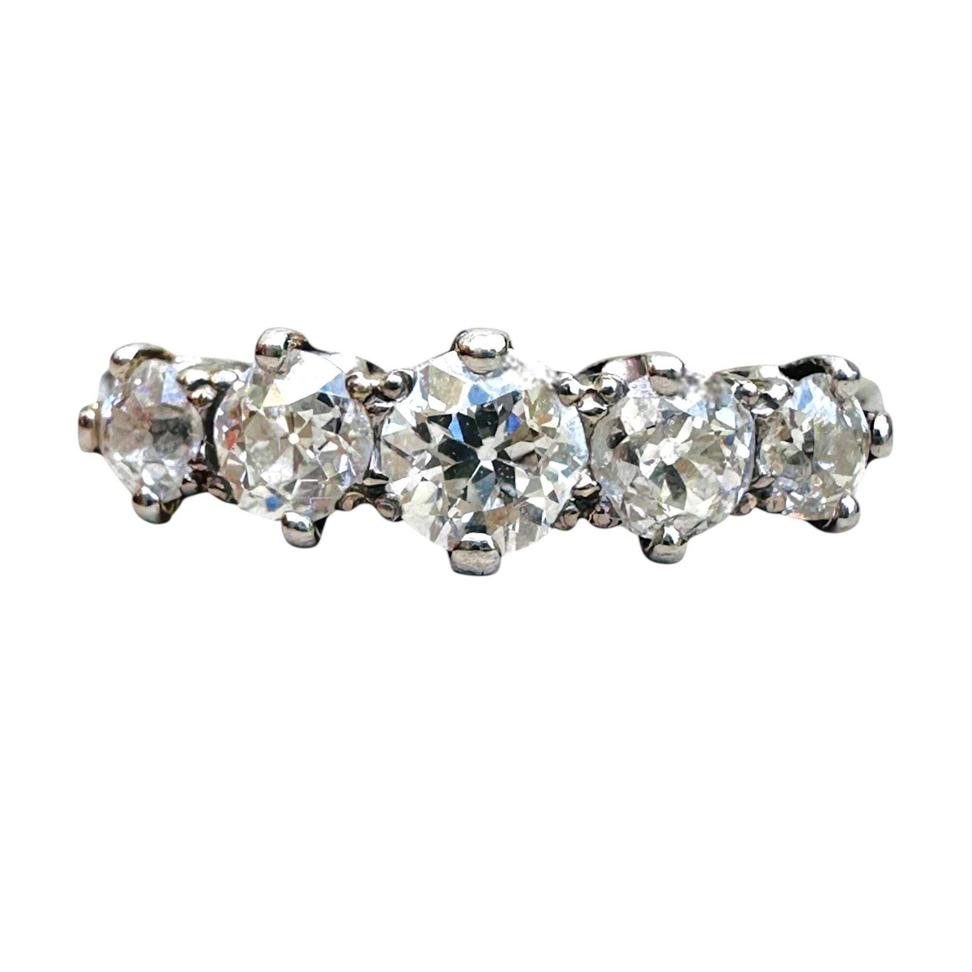 Edwardian five-stone diamond ring in 18K white gold with old European cut diamonds, featuring a 4.5mm center stone flanked by two 3.5mm and two 3mm diamonds, circa 1900s