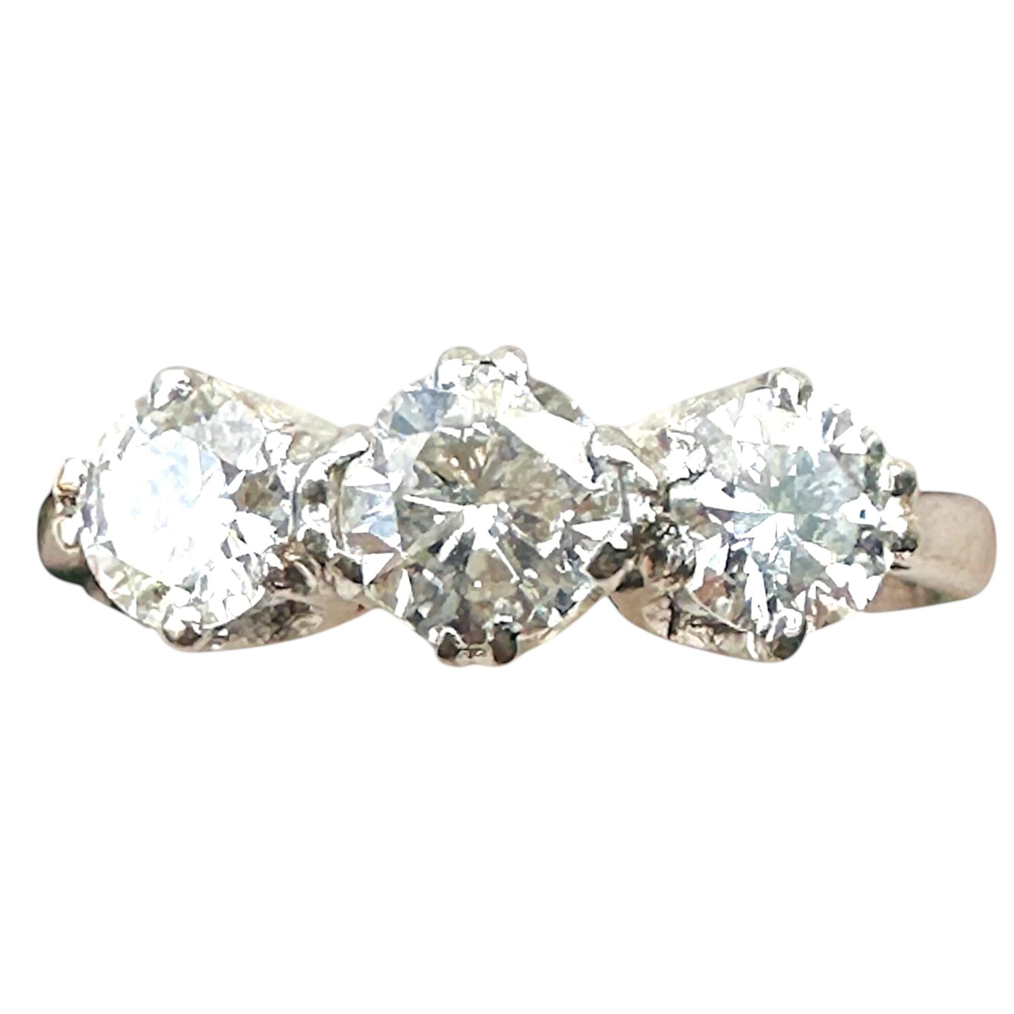 Mid-century platinum and brilliant cut diamond trilogy/three stone engagement ring