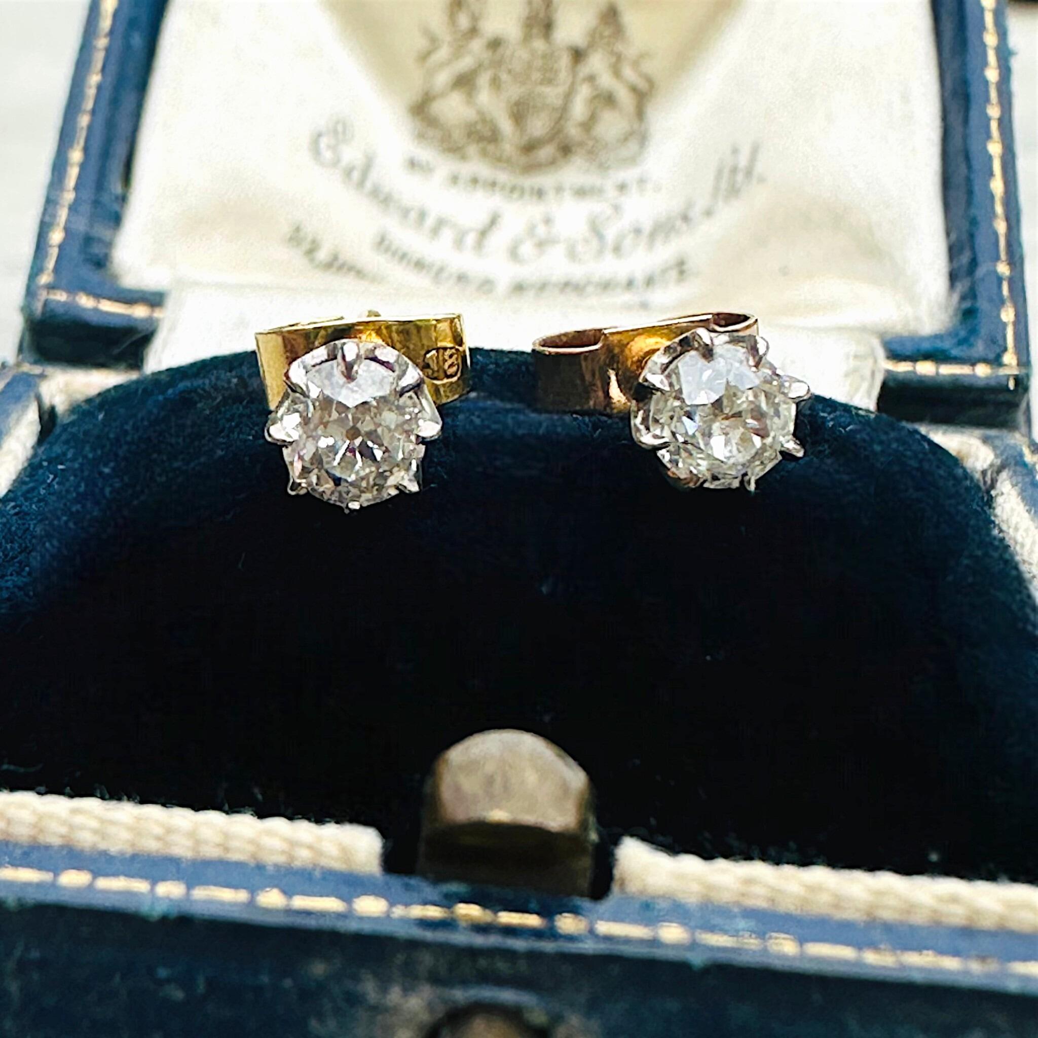 front view of Antique 18k Gold Old European Cut Diamond Stud Earrings displayed on antique box