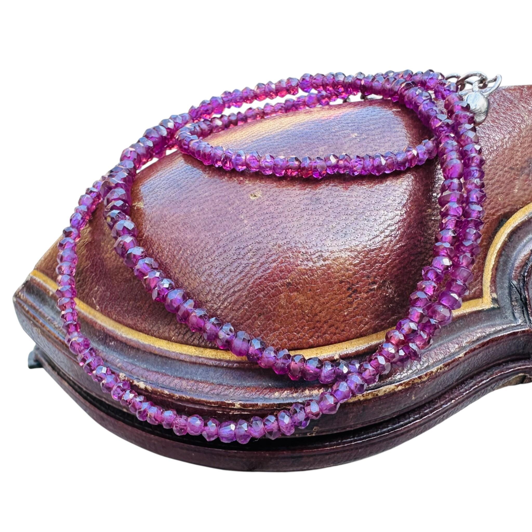Silver & Amethyst Bead Necklace displayed on antique box with white background
