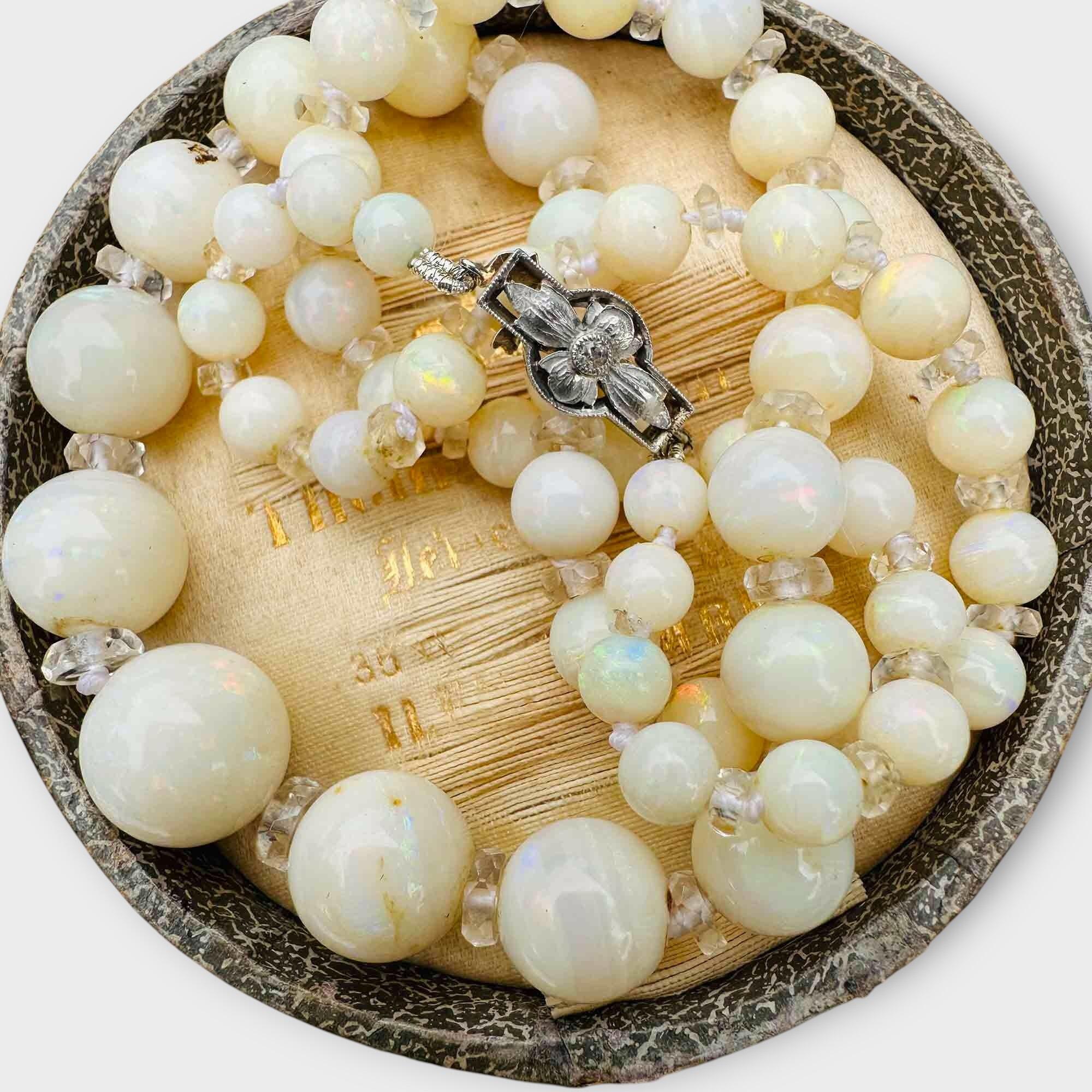 Exquisite, Edwardian Graduated Opal and rock crystal necklace on diamond clasp, Circa 1910, in an antique box.