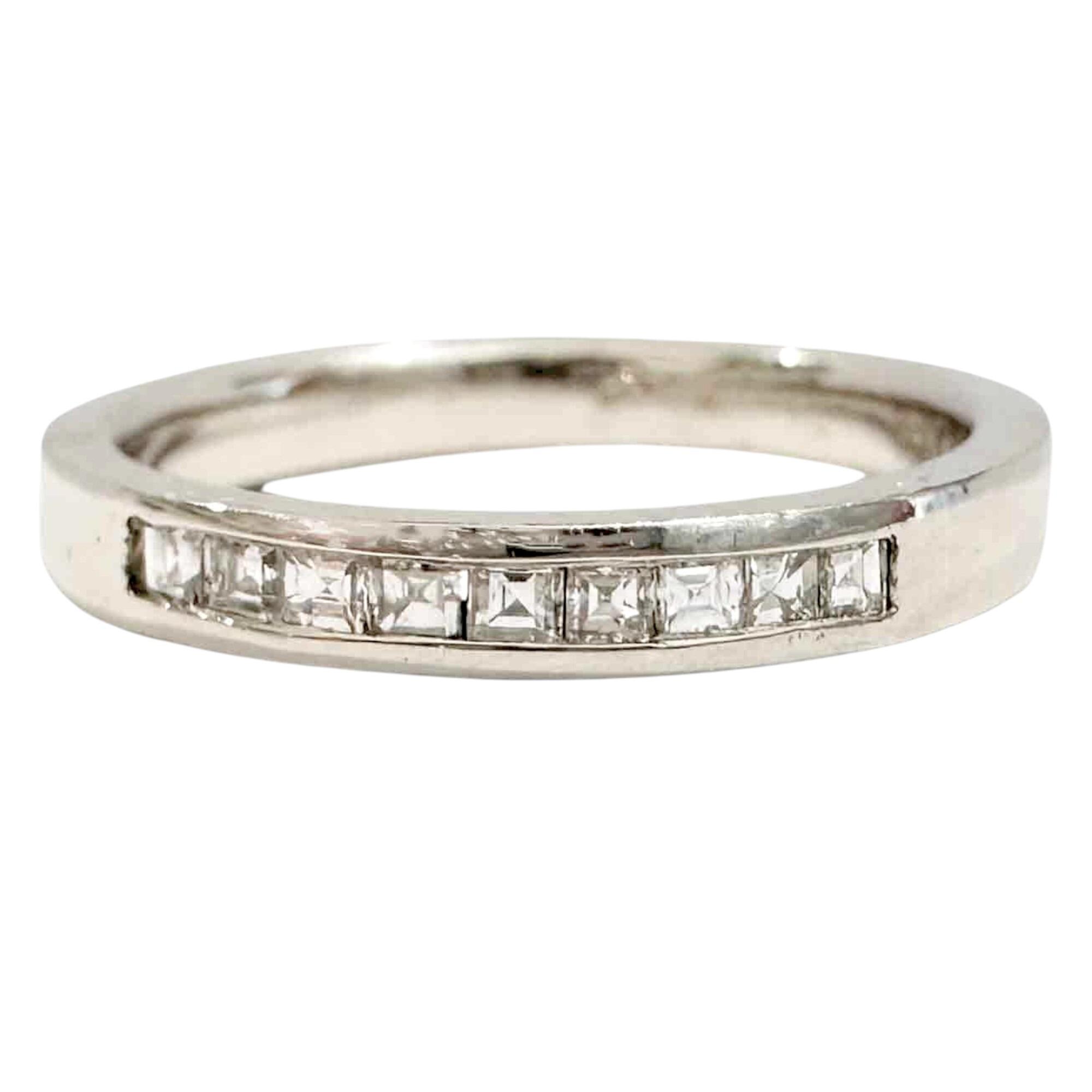 platinum ring with princess cut diamonds set in half eternity
