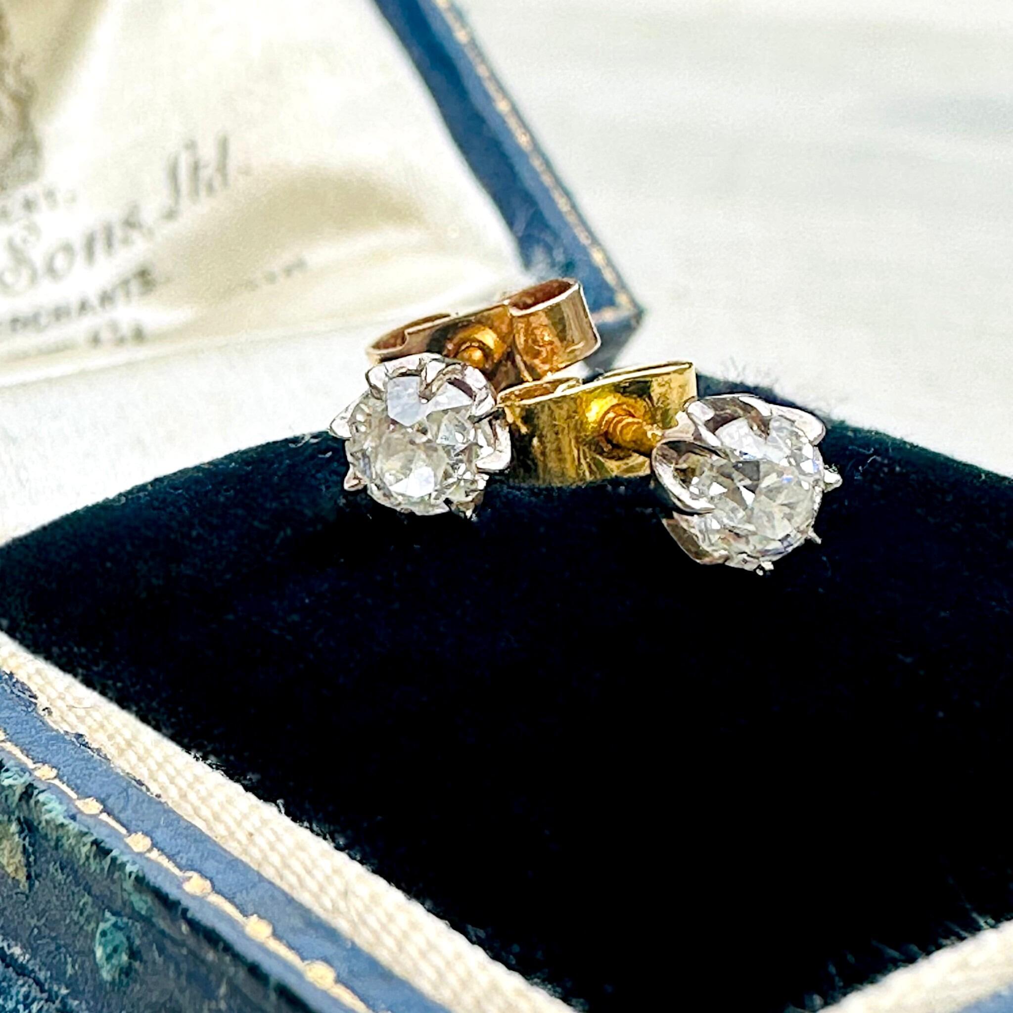 side profile of Antique 18k Gold Old European Cut Diamond Stud Earrings displayed on antique box