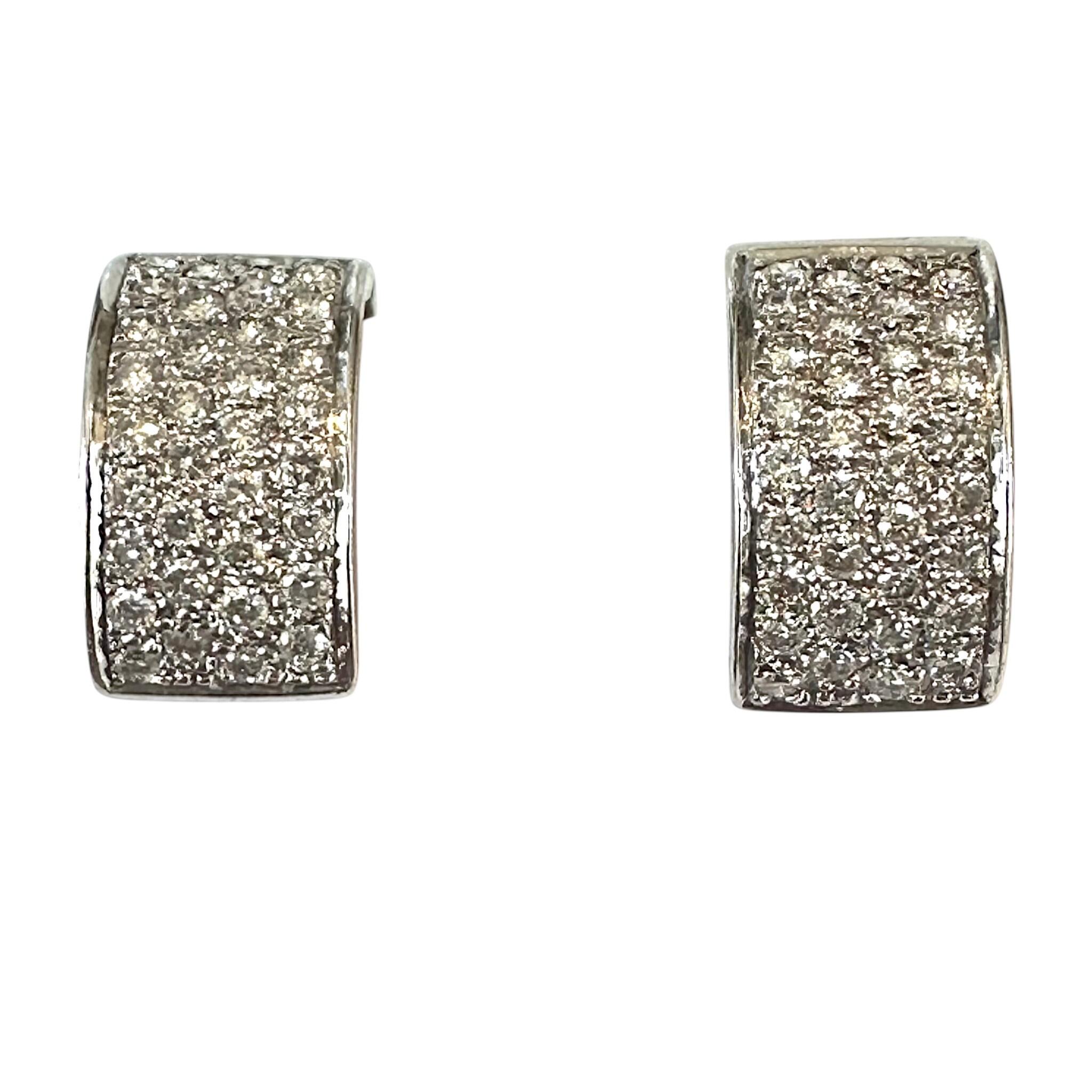 close up of 18k White Gold Diamond Pavé Huggie Earrings with white background