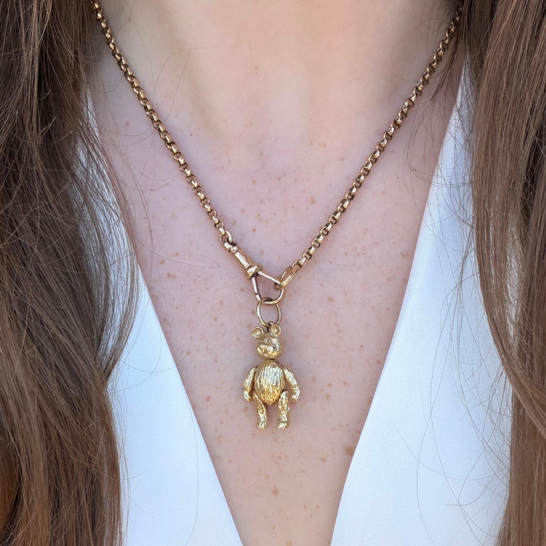 Vintage Gold Articulated Teddy Bear Charm Pendant,  displayed on gold chain worn by model