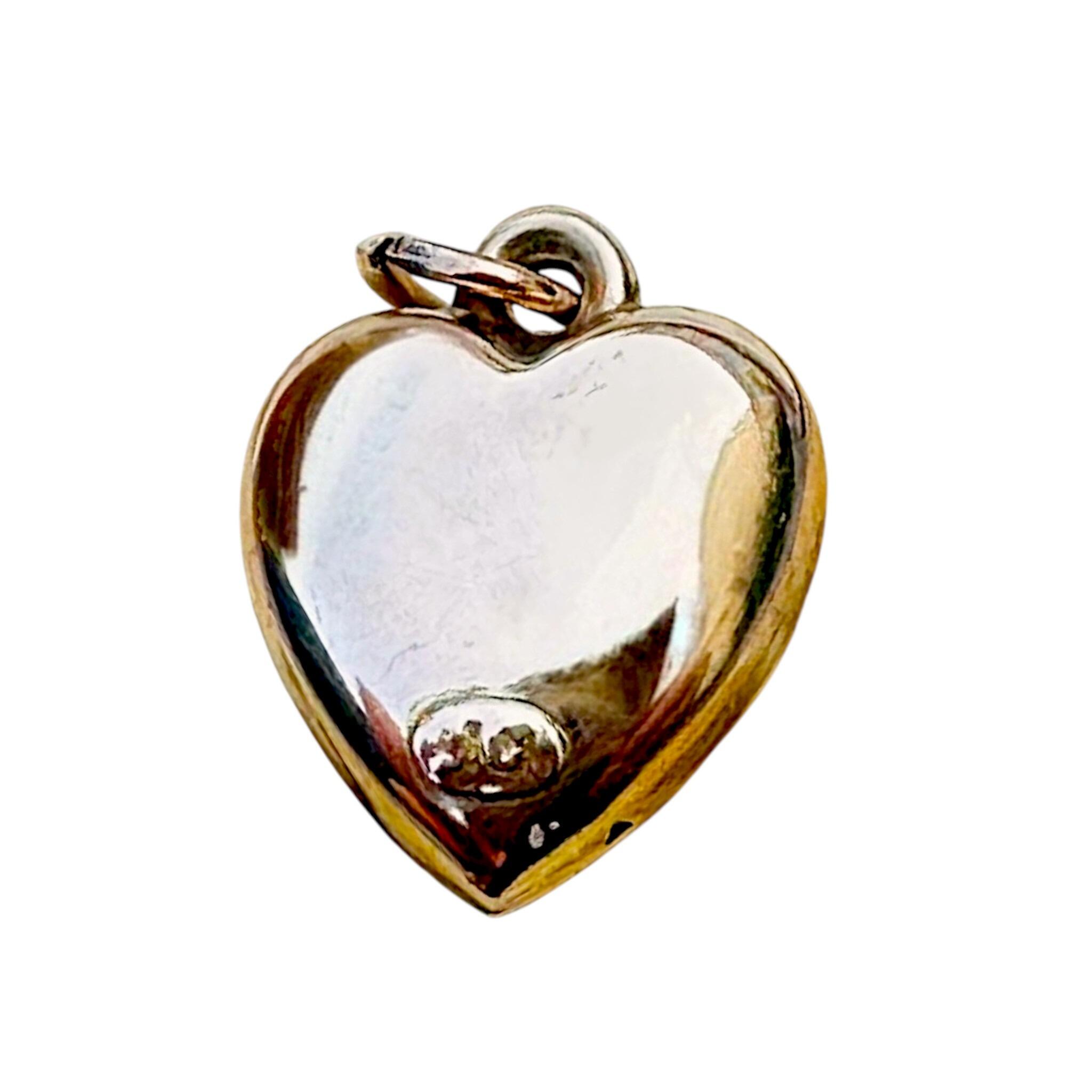 front view of Antique Art Nouveau 9ct Rose Gold Puffy Heart Pendant on white background