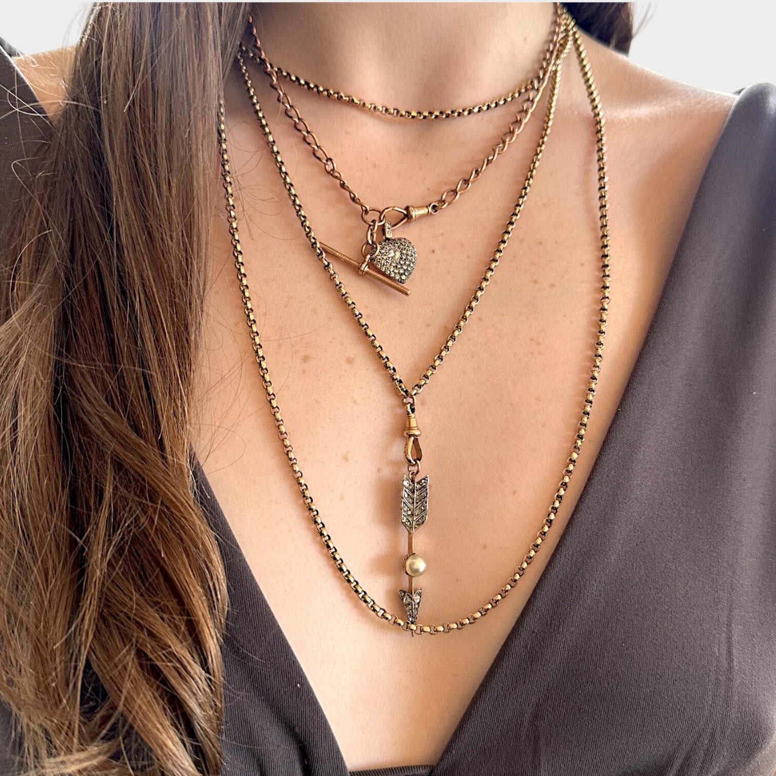 Rose Gold Curb Link Albert Chain With T-Bar & Dog Clip, worn on models  neck.