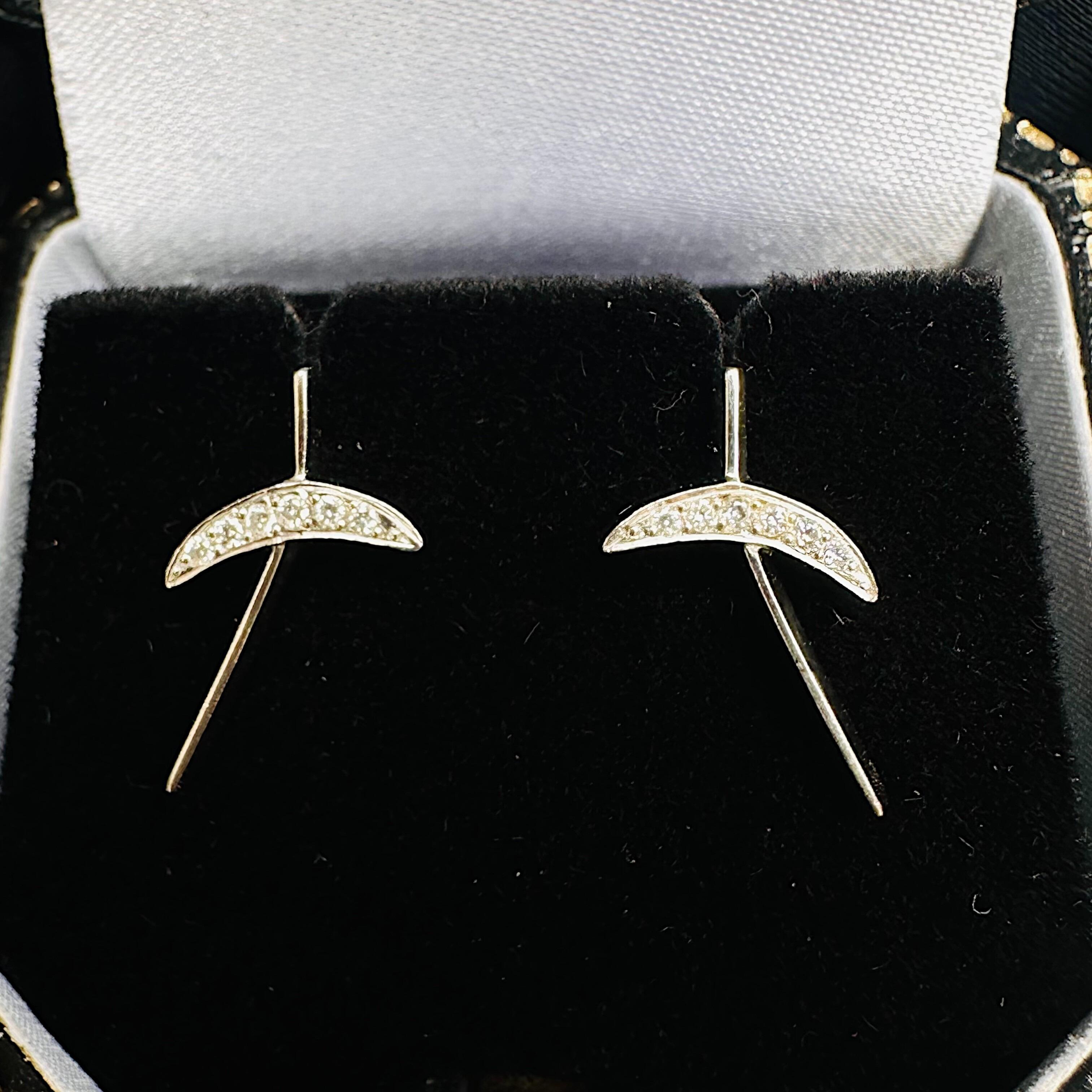 Platinum & Diamond Kiss Earrings displayed in black velvet antique box