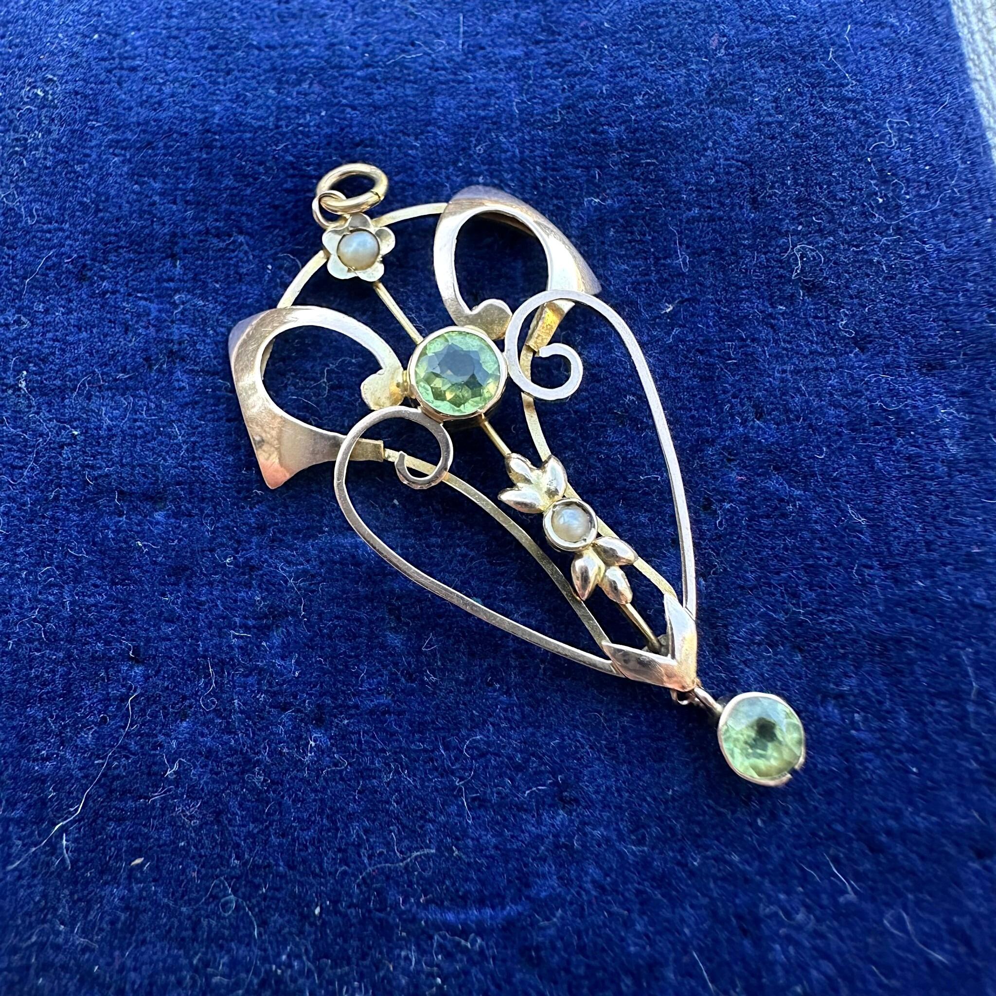 Rose Gold Peridot & Pearl Heart Pendant displayed on blue velvet antique box