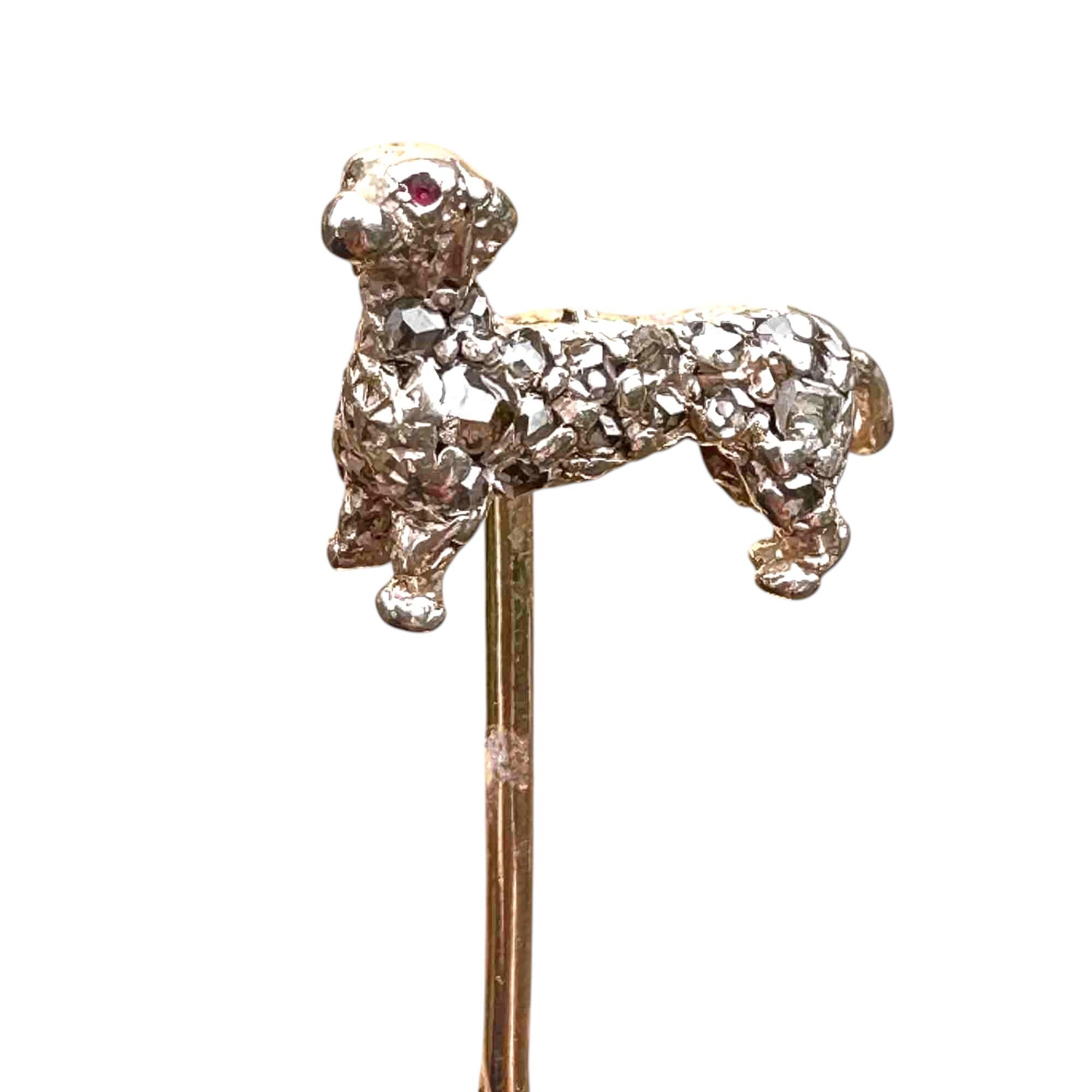Early Victorian rose-cut diamond studded dog stick pin with ruby eye in silver mounted on a yellow gold pin