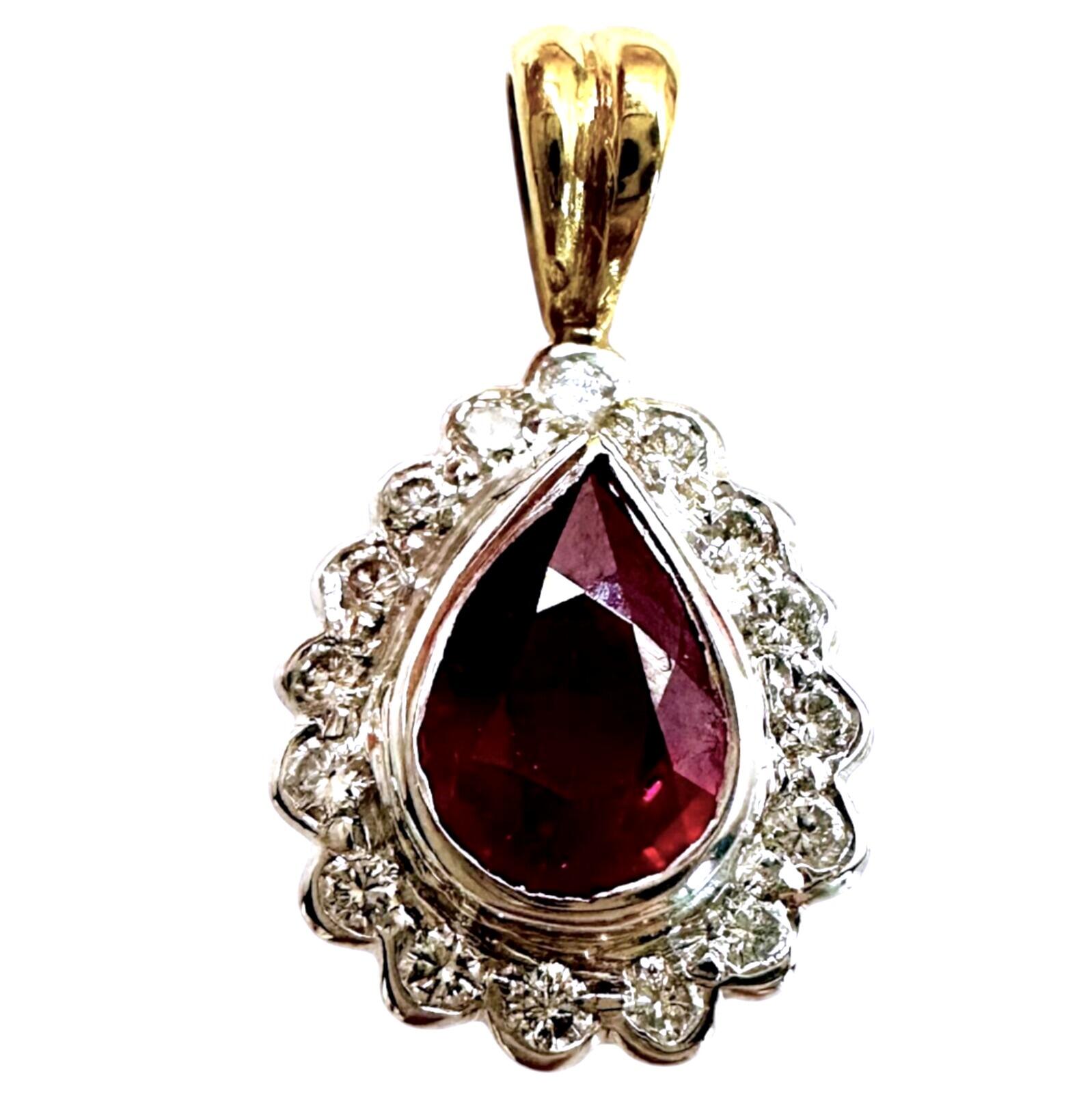 18k gold diamond and ruby pear shaped cluster pendant, white background.
