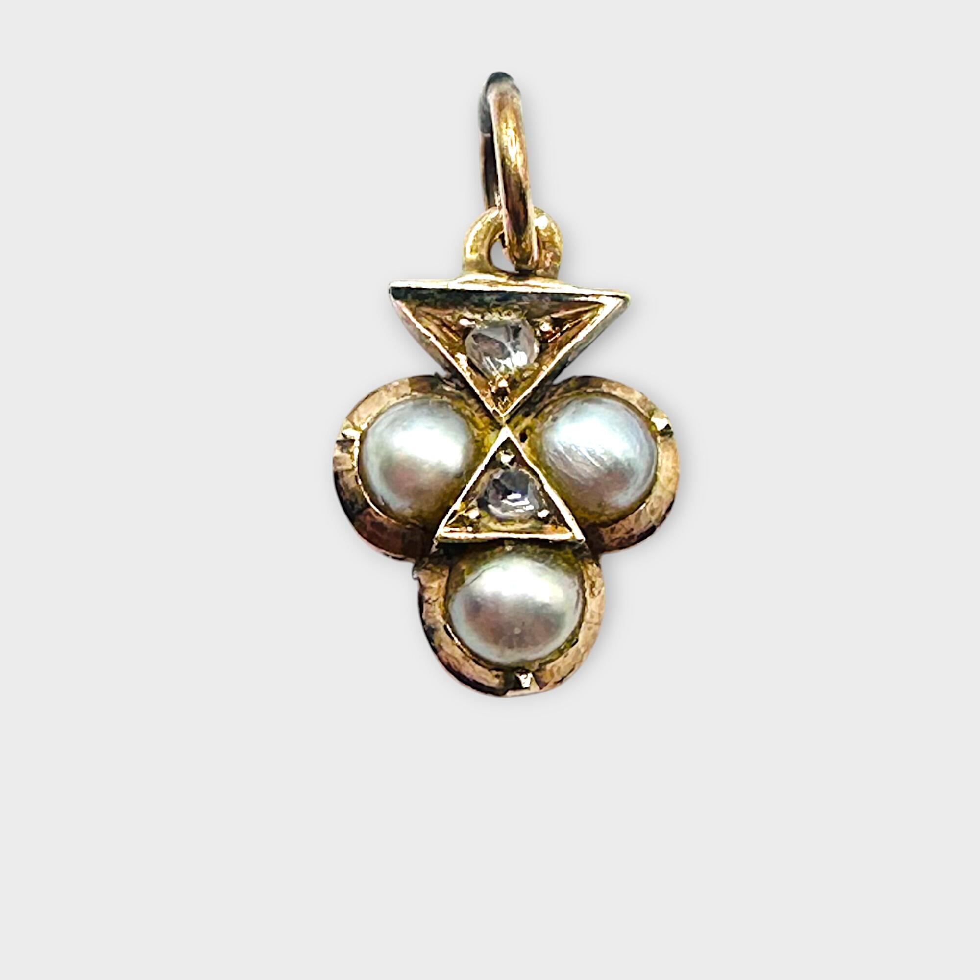antique trefoil pearl and diamond charm, pendant on grey background.